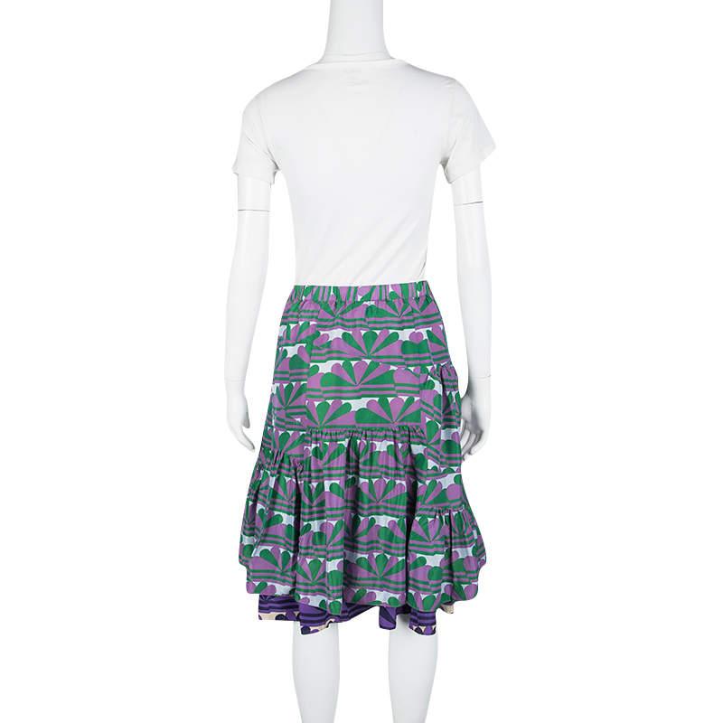 This skirt from Marc Jacobs is sure to make your fall in love with it. The fabulous creation is designed with layers, ruffles at the bottom and prints in multiple colours splayed all over. You can pair this piece with a blouse and wedge sandals.

