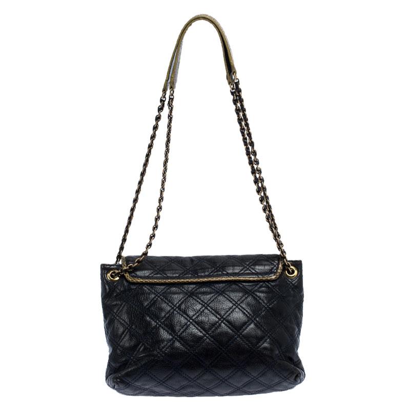 A fine mix of charm and fashion, this leather bag is sure to add style to your wardrobe. The turn-lock opens up to showcase a leather-lined interior for your essentials. The bag is decorated with quilting and held by chains.

