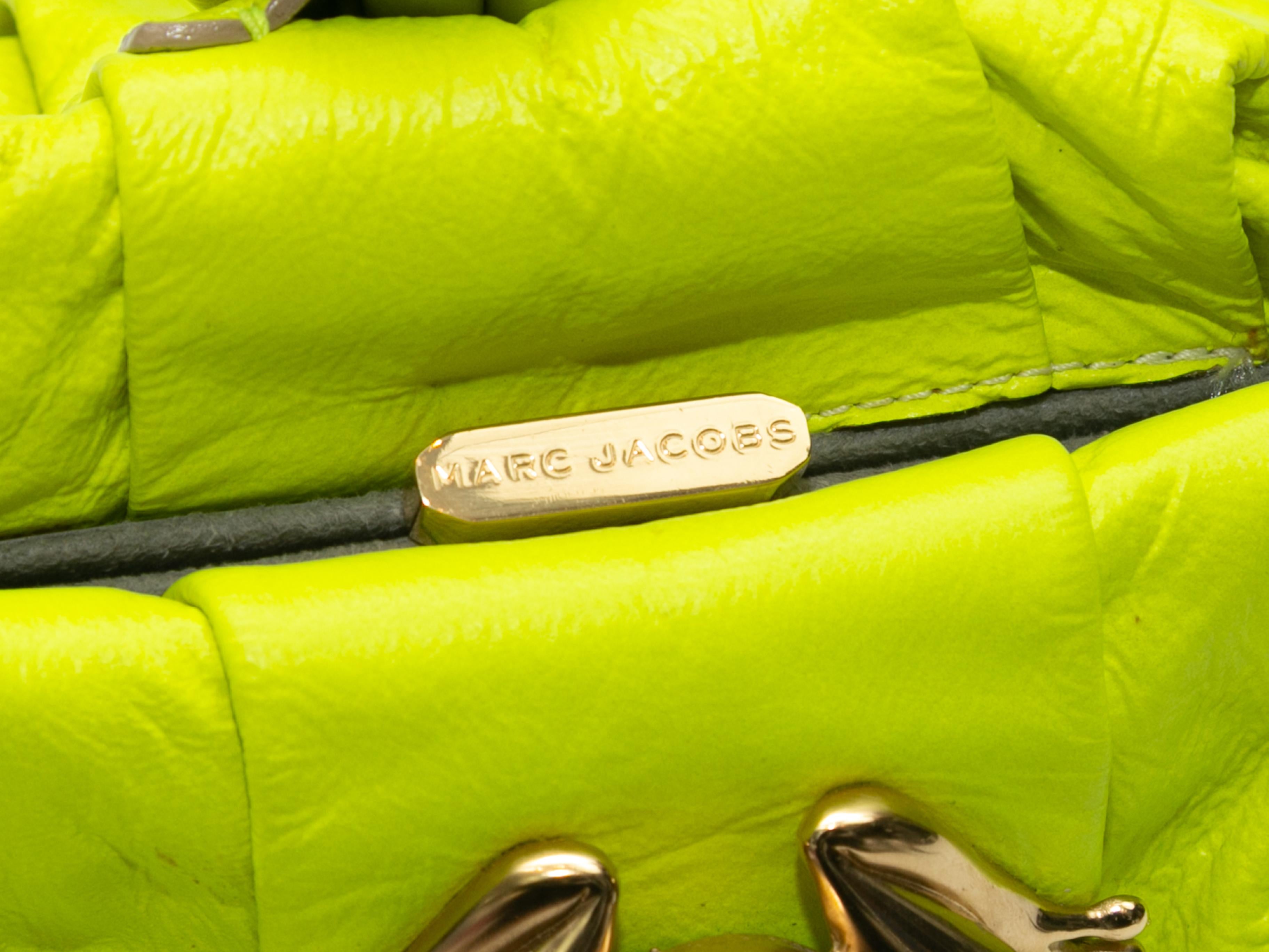 Product Details: Neon Lime Marc Jacobs Rana 2008 Frog Handbag. This bag features a leather body, a rolled wristlet strap, grey satin interior, exterior frog adornment, and top clasp closure. 9