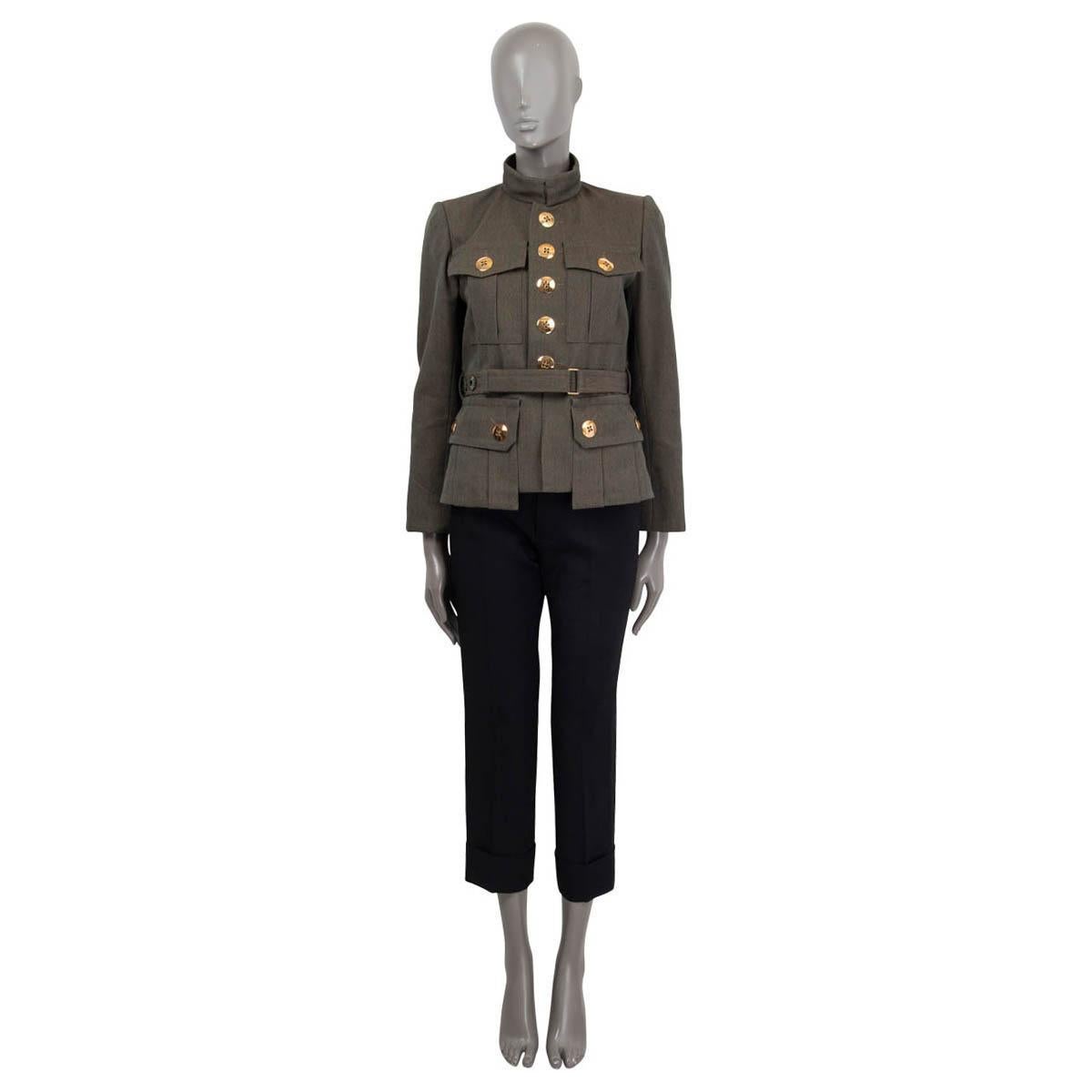 100% authentic Marc Jacobs belted military jacket in olive green wool (100%). Features long sleeves, a detachable belt and four buttoned patch pockets on the front. Opens with big gold-tone buttons and two hooks on the front. Lined in gray silk