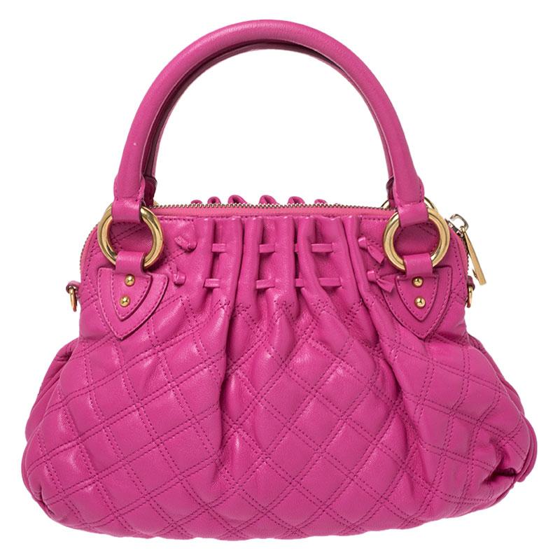 Every woman needs a bag that is pretty and functional, just like this Cecilia satchel from Marc Jacobs. Crafted from pink quilted leather, it has been styled with a zip detailing on the front. A zip-top closure opens to a spacious fabric-lined
