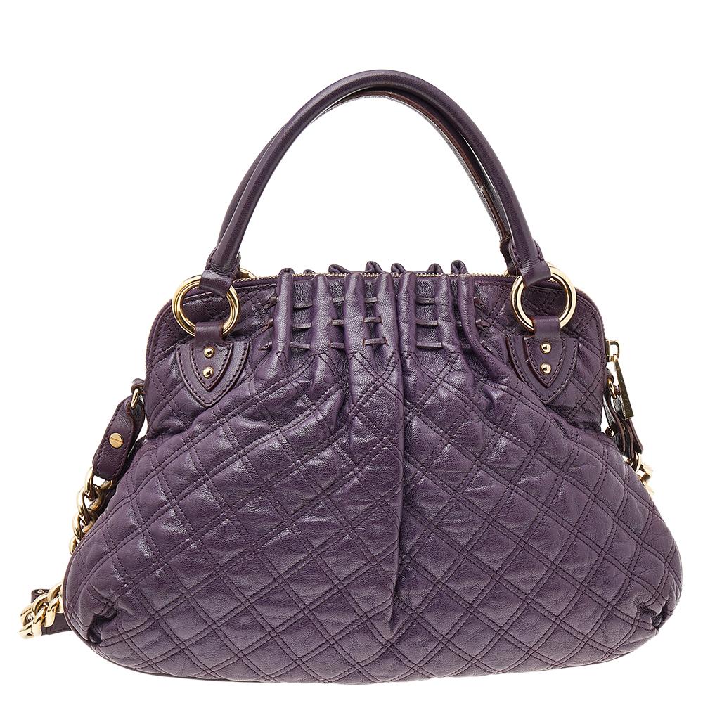 Every woman needs a bag that is pretty and functional, just like this Cecilia satchel from Marc Jacobs. Crafted from purple quilted leather, it has been styled with a zip detailing on the front. A zip-top closure opens to a spacious fabric-lined