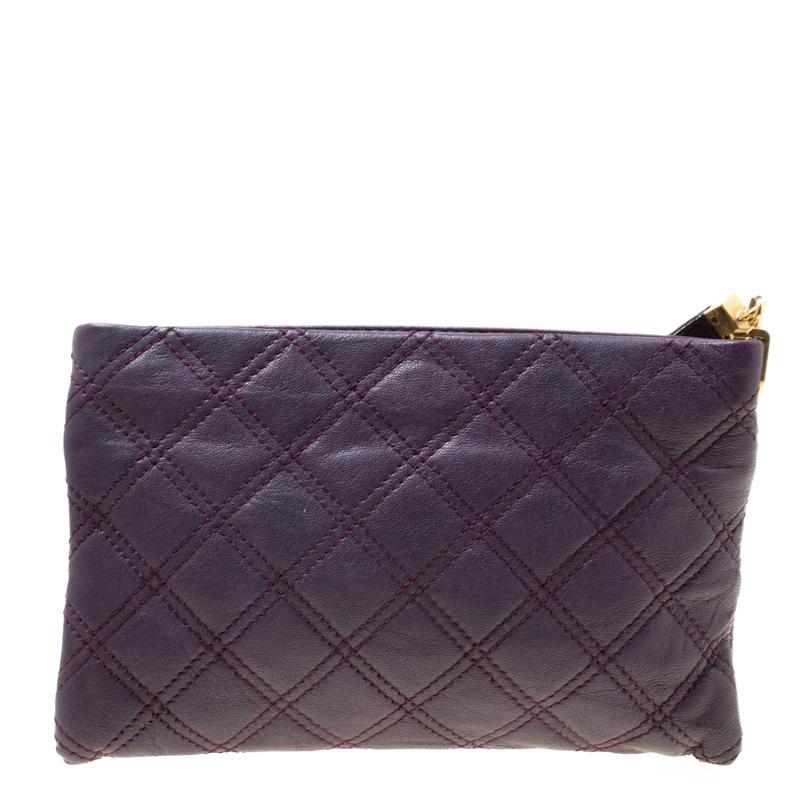 Cute and adorable, this wristlet clutch from Marc Jacobs definitely needs to be on your wishlist! The purple creation is crafted from leather and features a quilted pattern all over it. It flaunts a logo engraved gold-tone lock detailing at the