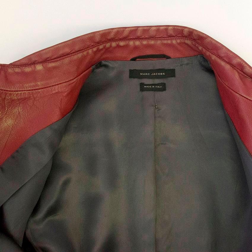 Distressed style red leather jacket with two pockets ribbed at the bottom.

Great condition 9.5/10. Please zoom in image to see item and condition in more detail. 

100% Calf leather

Approx. Sleeve 62cm 
            Length 71cm 
            Chest