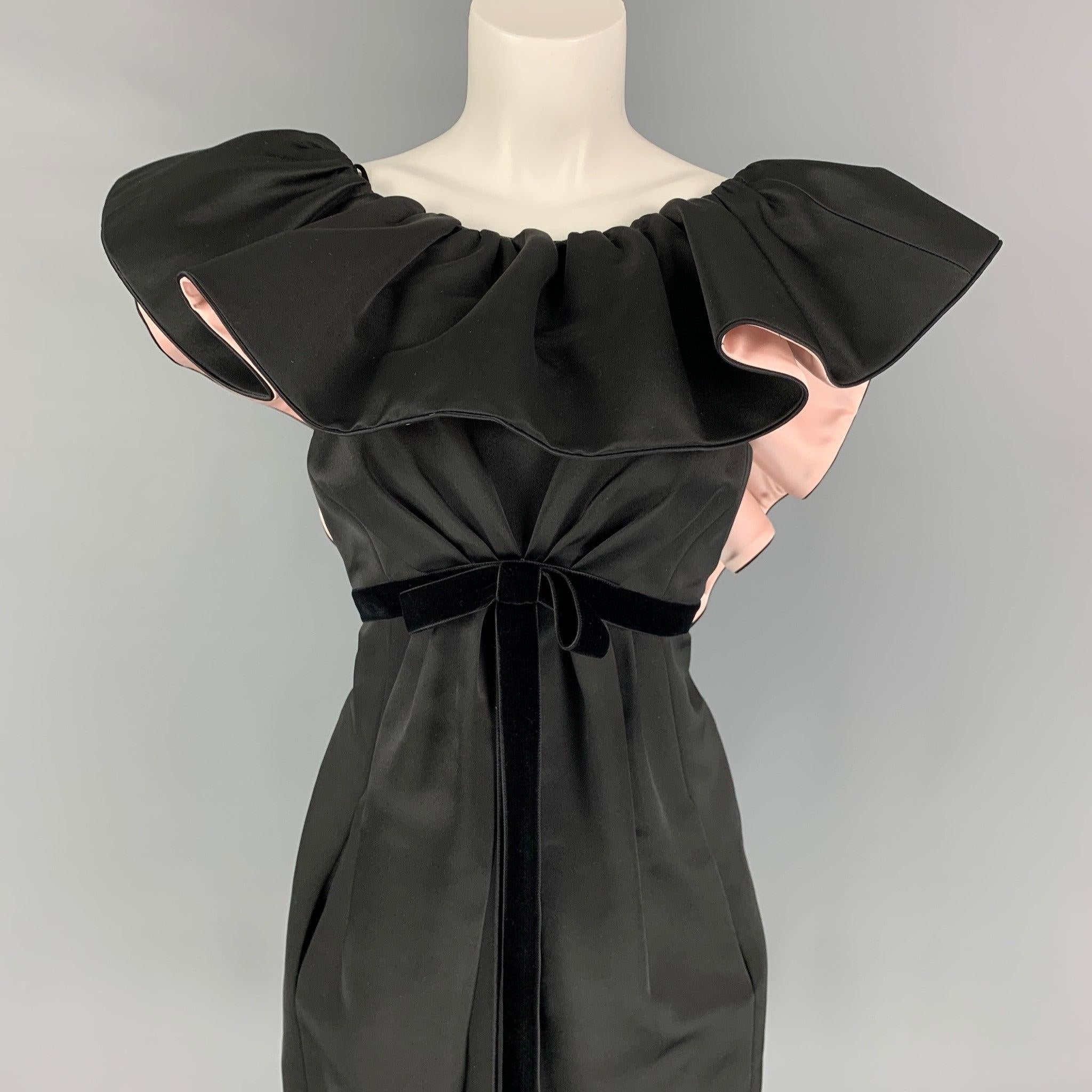 MARC JACOBS 'RUNWAY' cocktail dress comes in a black silk featuring a ruffle neckline design, open back, shift style, velvet tie belt at empire waist, slit pockets, and a back zip up closure. Made in USA,Excellent
Pre-Owned Condition. 

Marked:   6