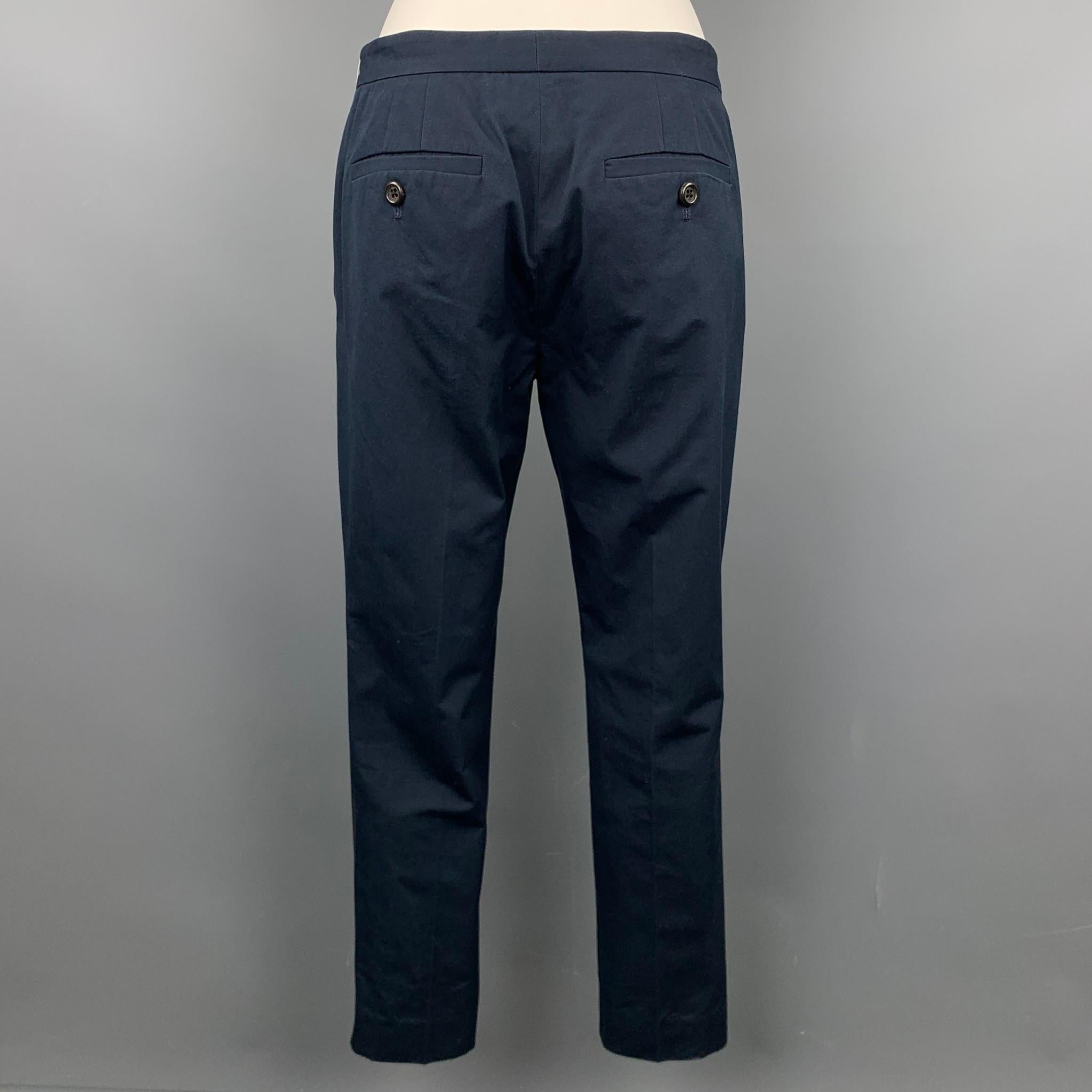 MARC JACOBS casual pants comes in a navy cotton featuring a chino style, narrow leg, and a zip fly closure.

Very Good Pre-Owned Condition.
Marked: 0

Measurements:

Waist: 30 in.
Rise: 8.5 in.
Inseam: 26 in.