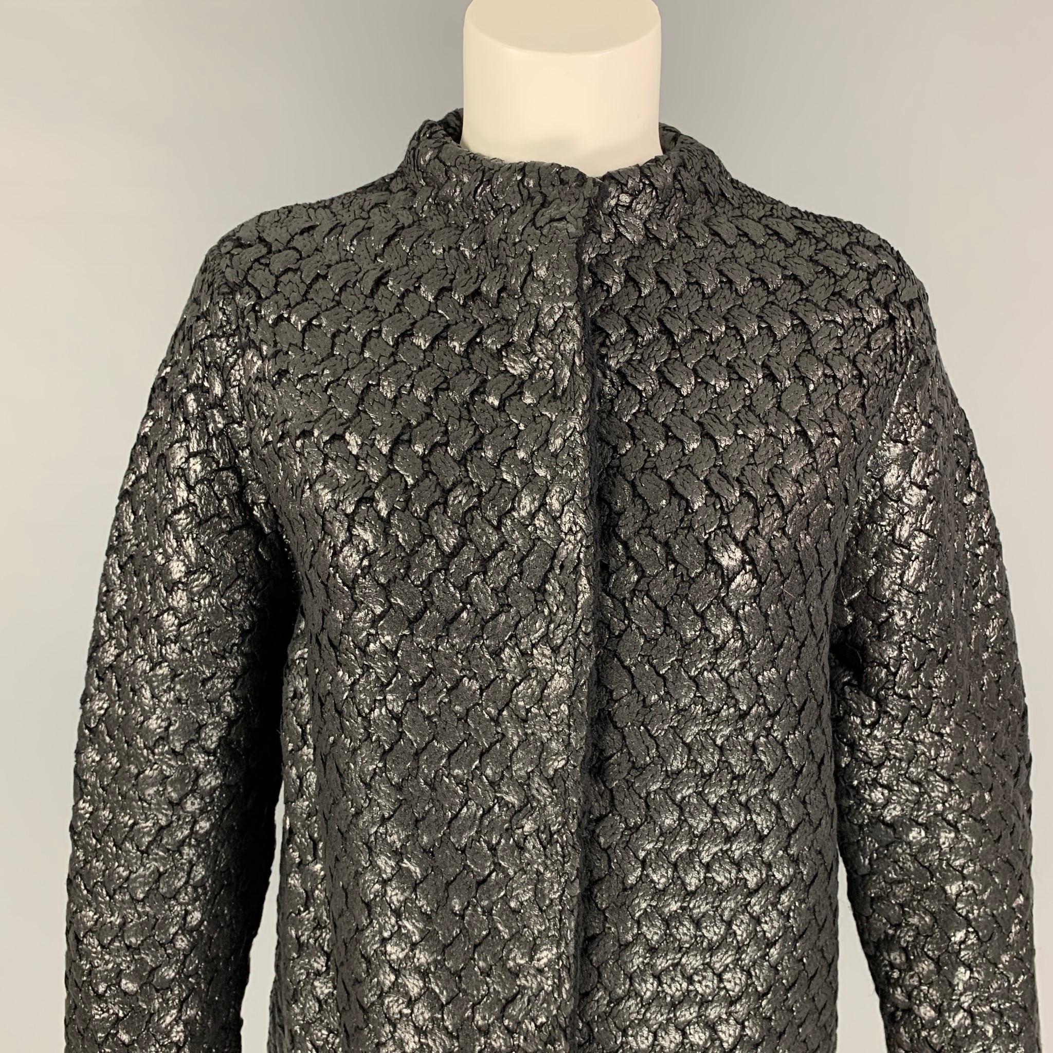 MARC JCOBS jacket comes in a silver & black jacquard floral polyester featuring a collarless style, slit pockets, and a hidden placket closure. Made in Italy.

Very Good Pre-Owned Condition.
Marked: L

Measurements:

Shoulder: 15.5 in.
Bust: 36