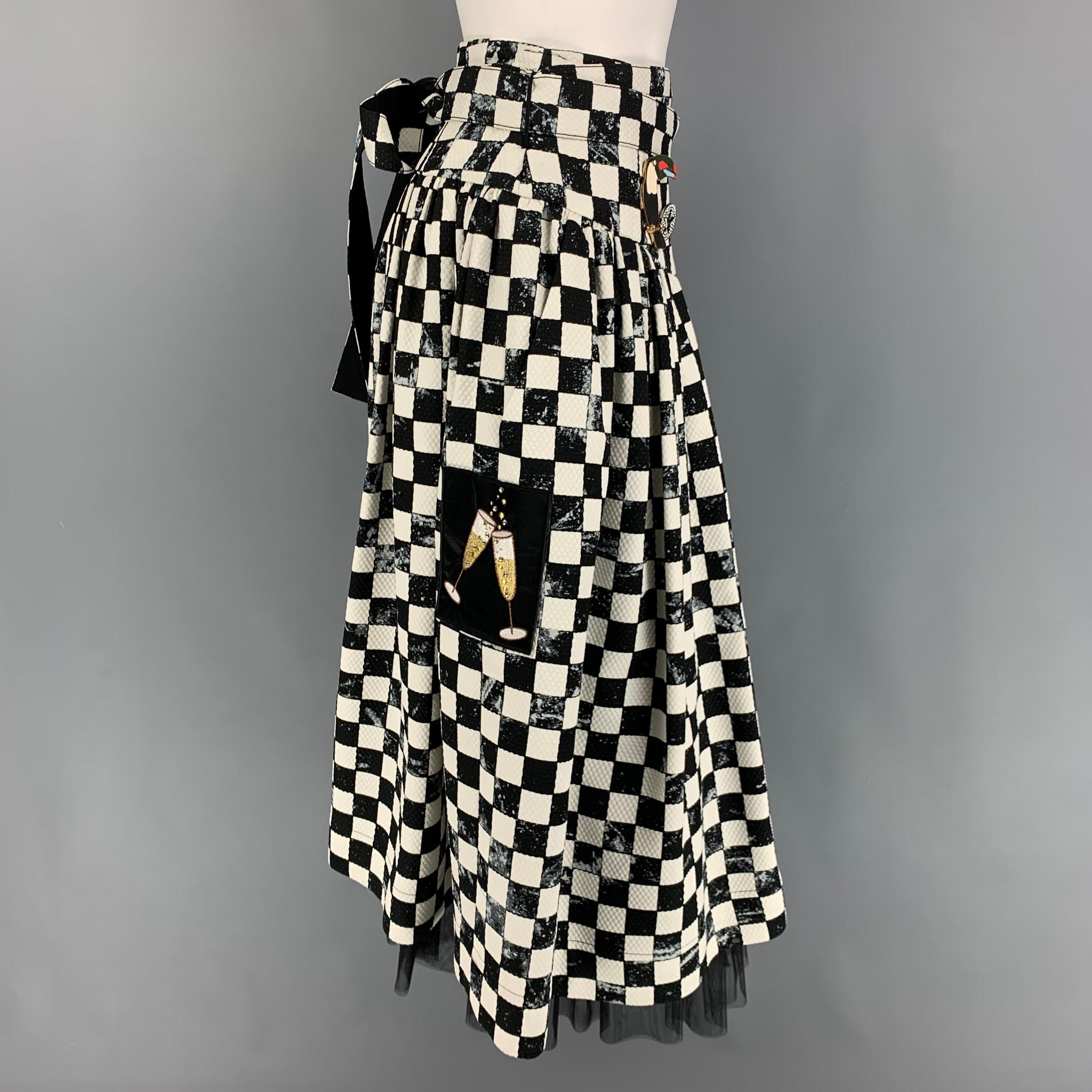 MARC JACOBS skirt comes in a black & white checkered cotton blend with a mesh liner featuring a circle style, two pin details, patches, belted, and a back zip up closure. Belt detail could be styled in other ways. 

Excellent Pre-Owned