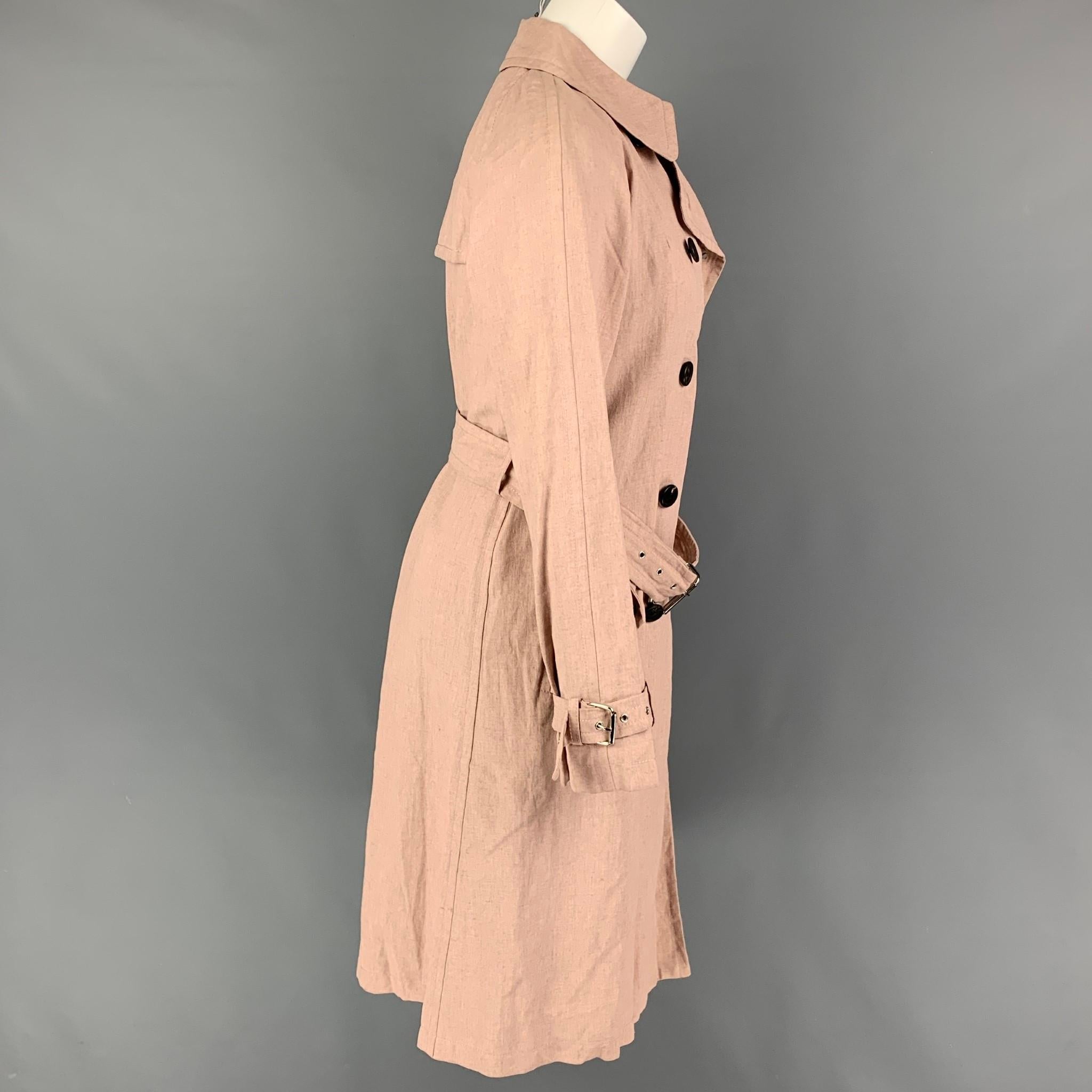 MARC JACOBS trench coat comes in a pink linen featuring a belted design, flap pockets, single back vent, amd a double breasted closure. Made in USA. 

Very Good Pre-Owned Condition.
Marked: 2

Measurements:

Shoulder: 16 in.
Bust: 36 in.
Sleeve: 23