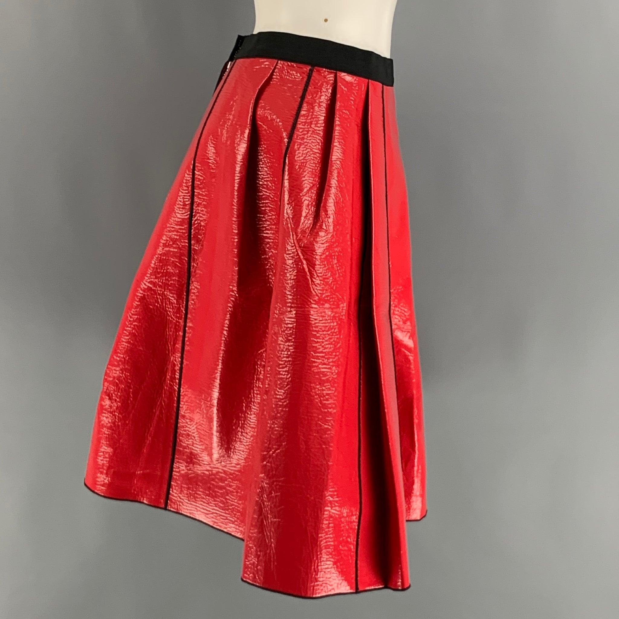 MARC JACOBS knee high skirt comes in a red coated cotton material featuring a a-line style, black top stitching contrast, and a zip up closure.Excellent Pre-Owned Condition. 

Marked:  
2 

Measurements: 
  Waist: 28 inches Hip: 44 inches Length: 21