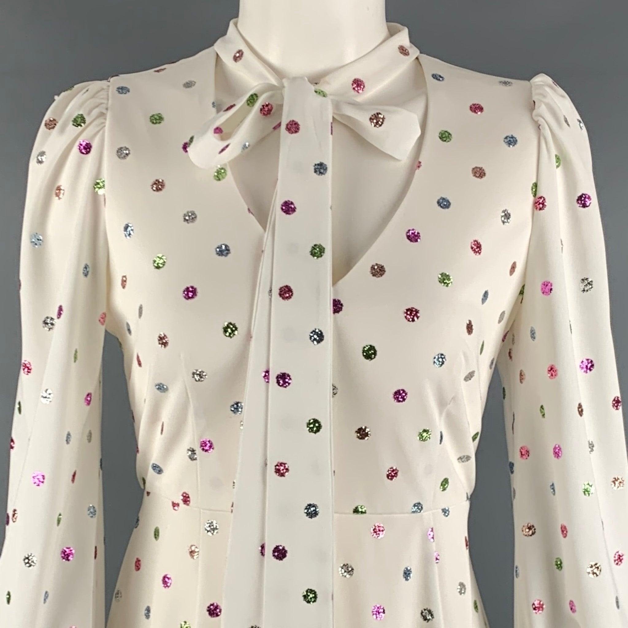 MARC JACOBS dress in a white polyester fabric featuring all over multi color glitter dots, pussycat bow, blouson sleeves, and V-neck.Very Good Pre-Owned Condition. Minor mark on bow, and pilling on right side. 

Marked:  2 

Measurements: 
