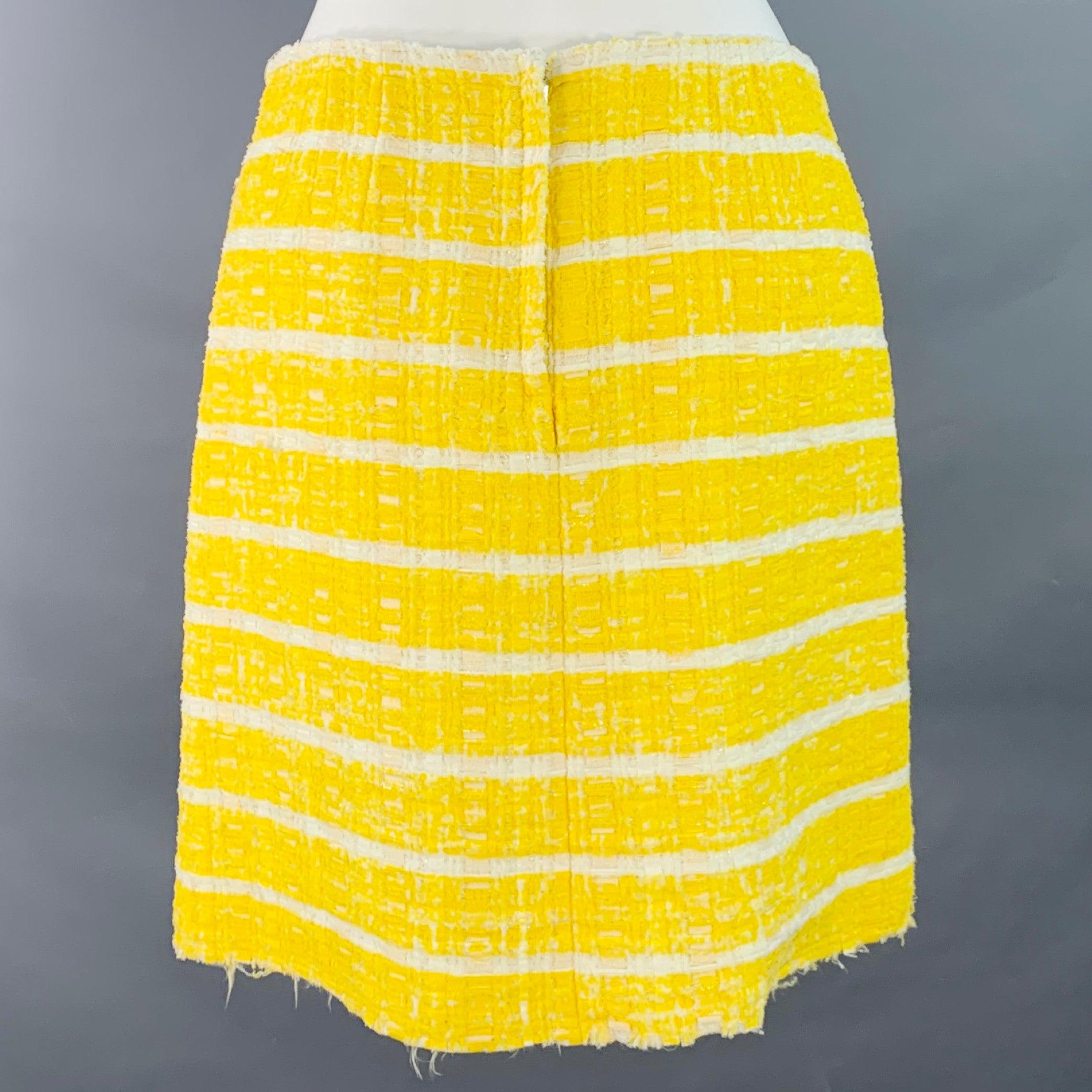 MARC JACOBS mini skirt
in a yellow and white nylon blend boucle featuring a stripe pattern, two patch pockets, and back zipper closure. Note: this garment has been professionally altered and shortened. Please double check measurements.Very Good