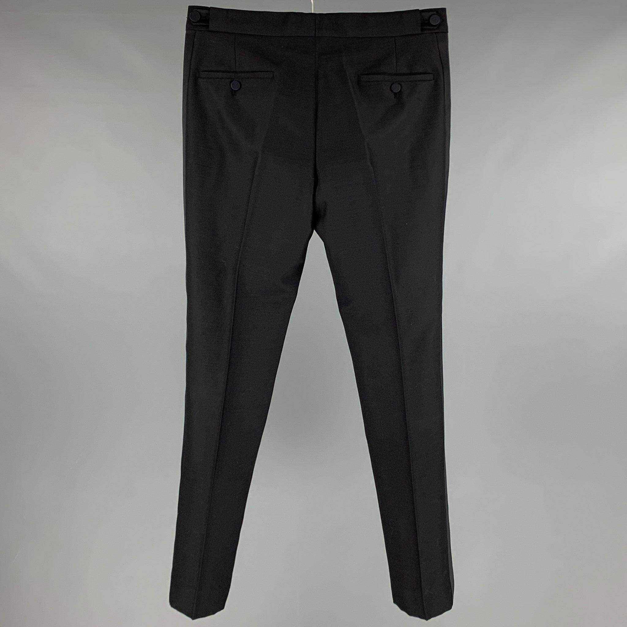 MARC JACOBS dress pants
in a black wool blend fabric featuring tuxedo stripes, side tabs, and a zip fly closure. Made in Italy.Excellent Pre-Owned Condition. 

Marked:   48 

Measurements: 
  Waist: 32 inches Rise: 8.5 inches Inseam: 31 inches Leg