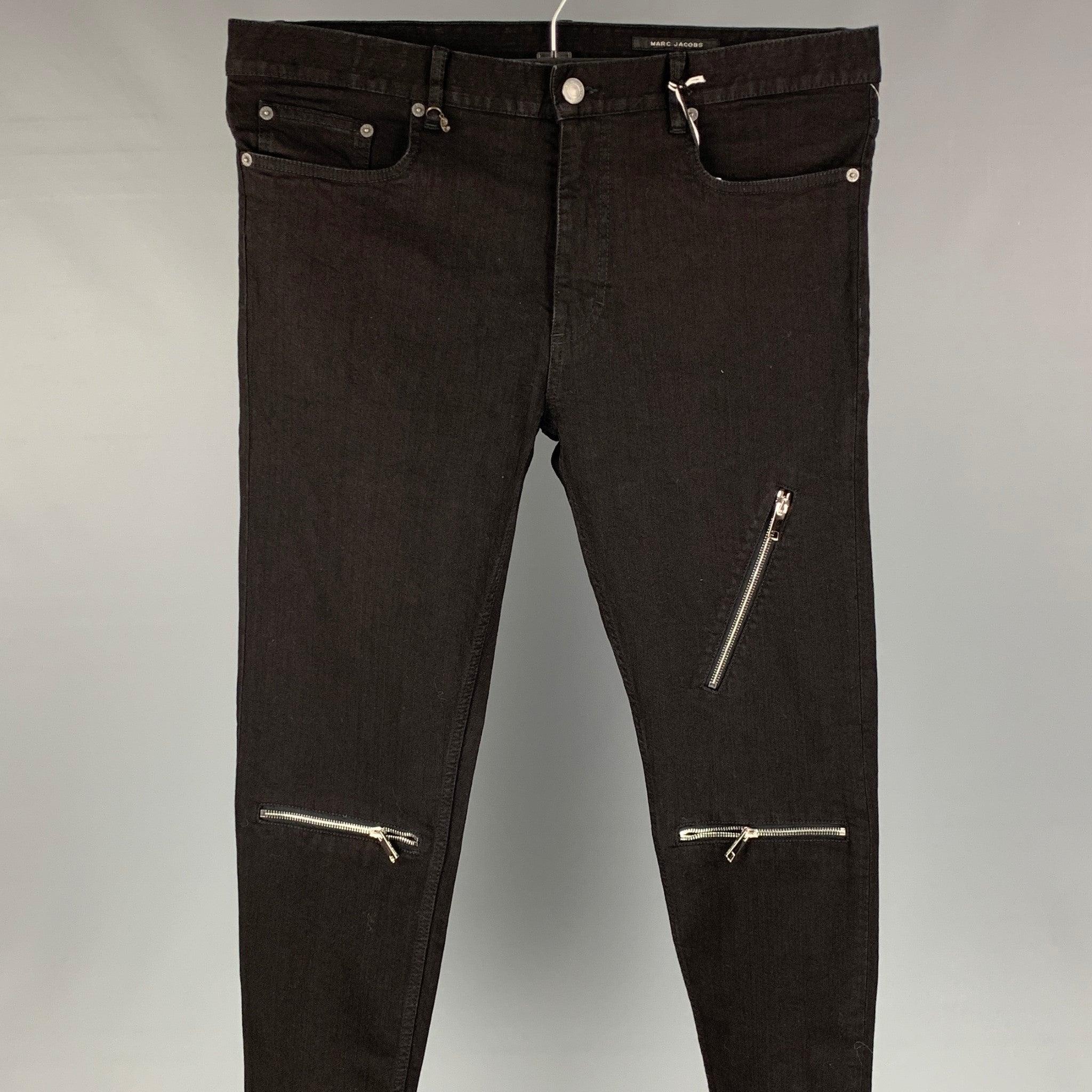 MARC JACOBS jeans comes in a black cotton featuring a slim fit, exposed zippers, and a zip fly closure. Made in Italy.
New With Tags.
 

Marked:   52 

Measurements: 
  Waist: 36 inches  Rise: 11 inches  Inseam: 32 inches 
  
  
 
Reference: