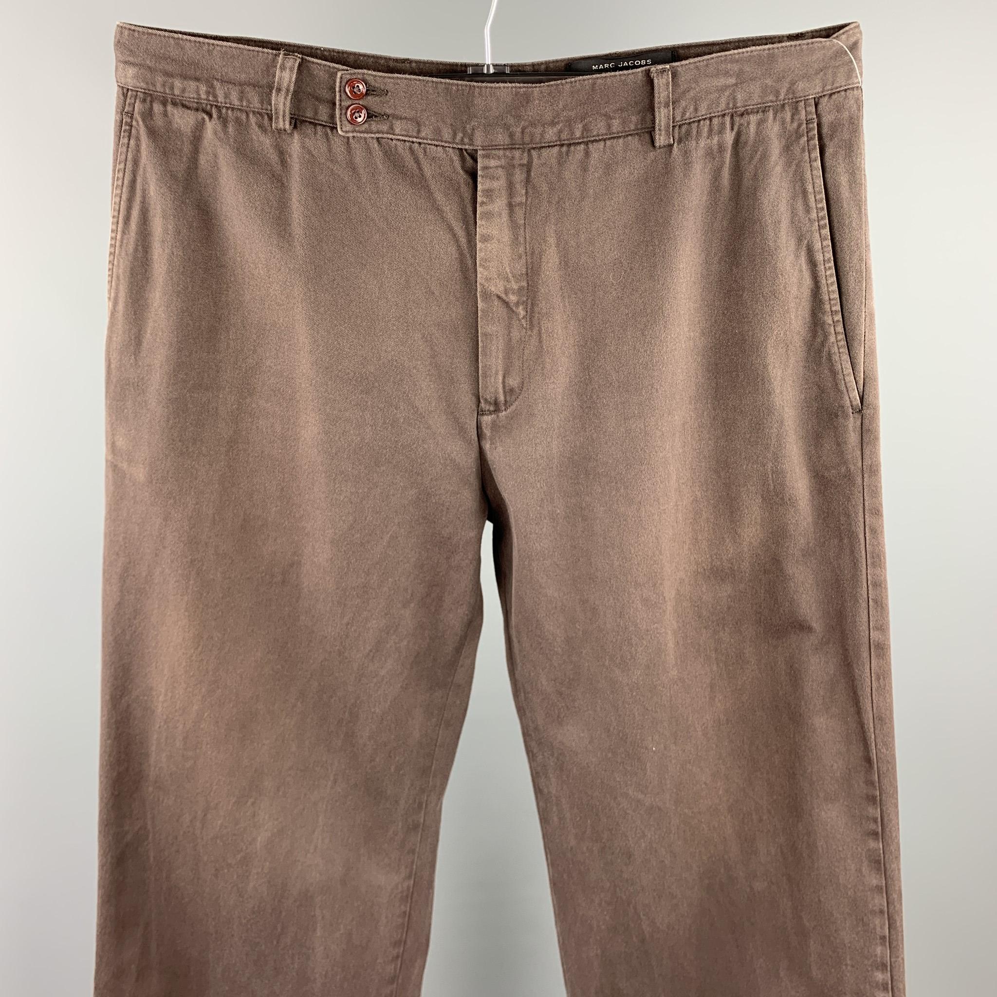 MARC JACOBS dress pants comes in a brown cotton featuring a extreme wide leg style, double front button, and a zip fly closure. Made in Italy.

Good Pre-Owned Condition.
Marked: IT 52

Measurements:

Waist: 36 in. 
Rise: 11 in. 
Inseam: 35 in. 