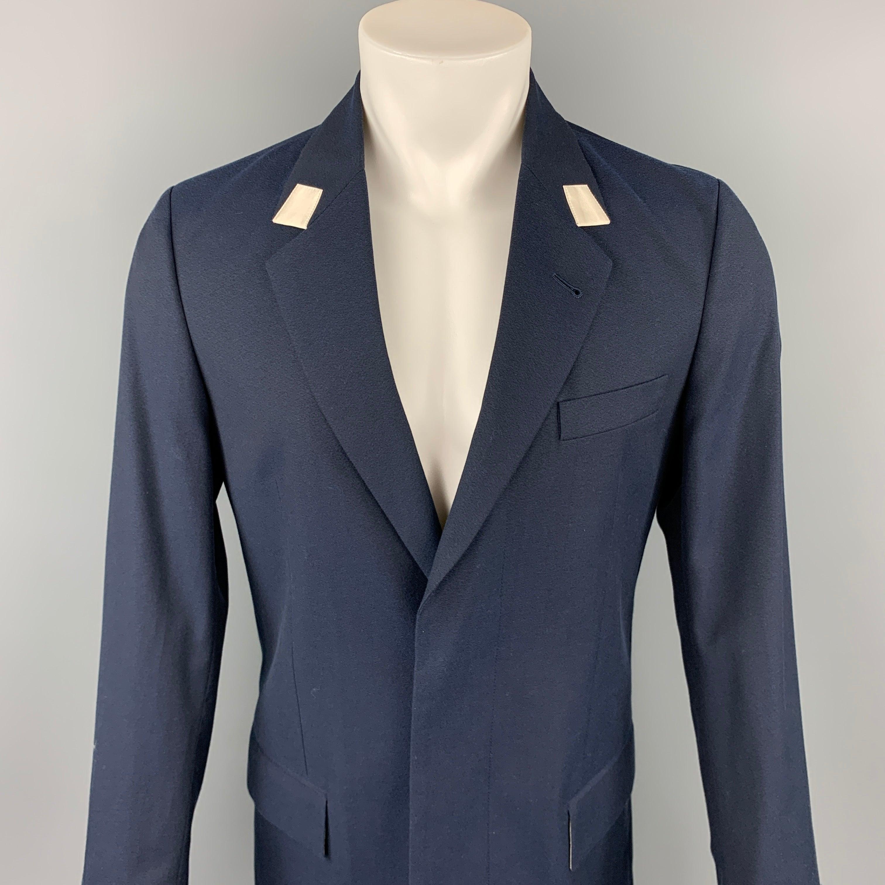 MARC JACOBS coat comes in a navy wool / cotton with a full liner featuring a notch lapel, flap pockets, and a hidden button closure. Made in Italy.Excellent
Pre-Owned Condition. 

Marked:  IT 46 

Measurements: 
 
Shoulder: 17.5 inches Chest: 38