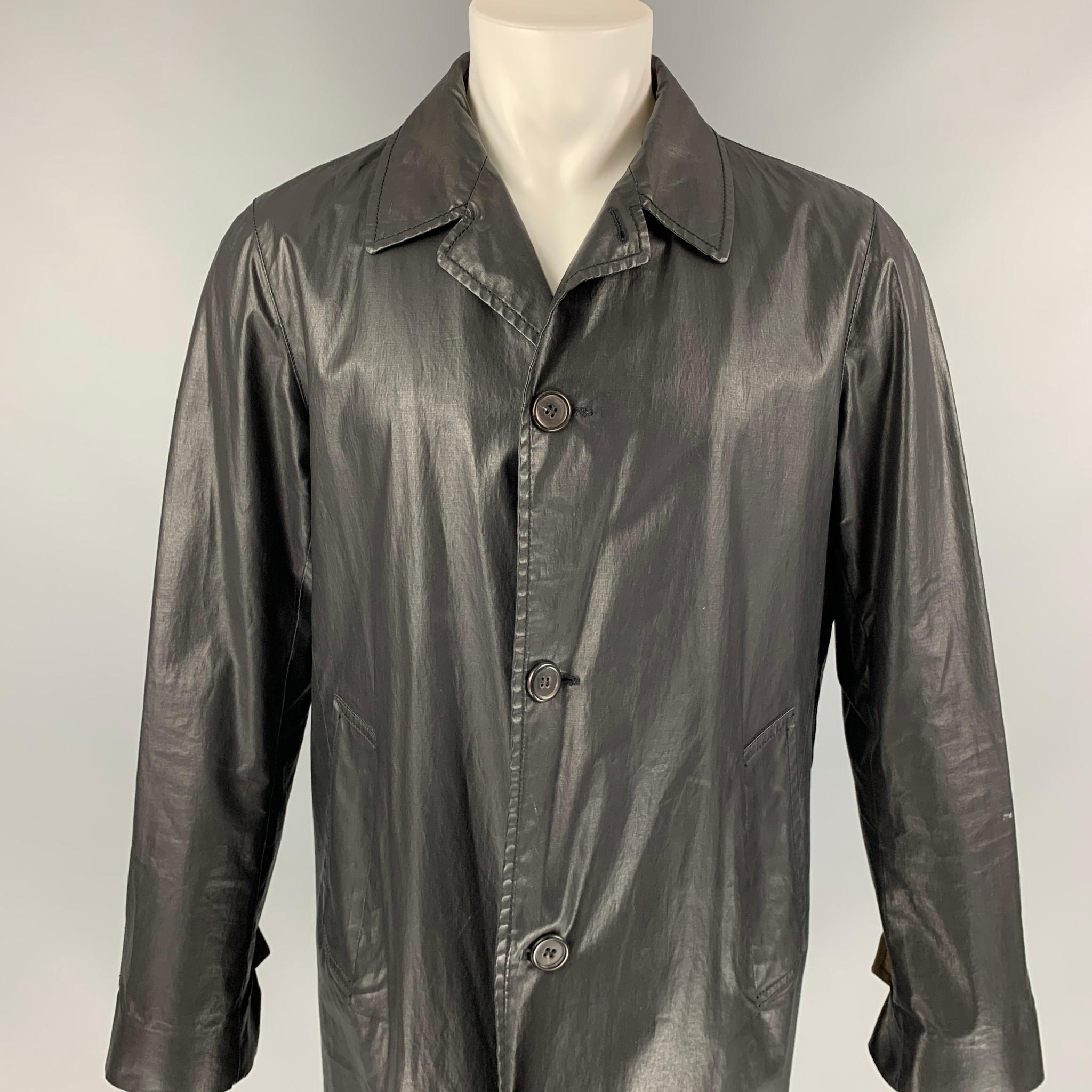 MARC JACOBS coat comes in a black coated canvas with a full liner featuring a spread collar, slit pockets, single back vent, and a buttoned closure. Made in Italy. 

Very Good Pre-Owned Condition.
Marked: 48

Measurements:

Shoulder: 19 in.
Chest: