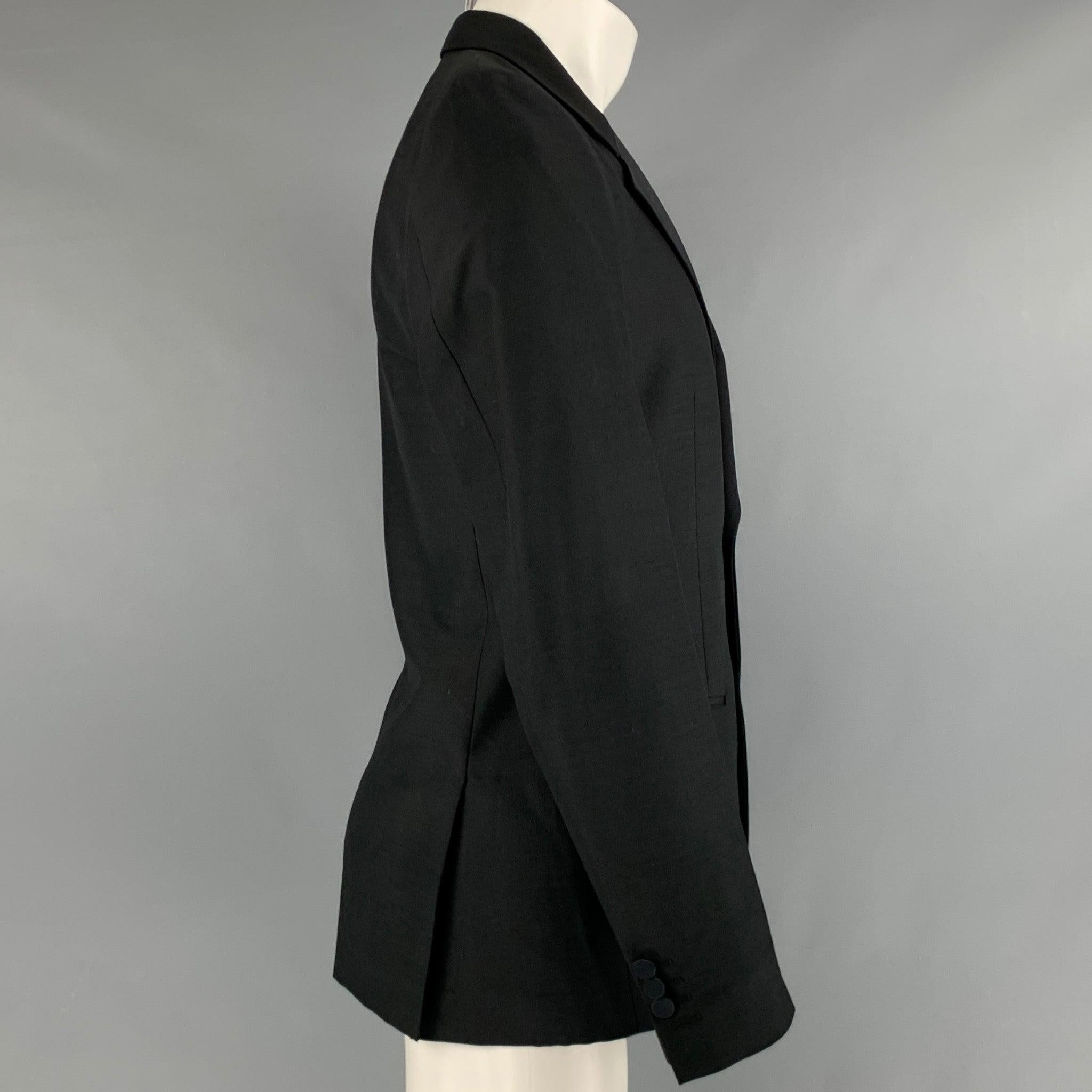 MARC JACOBS tuxedo sport coat
in a black wool polyester blend fabric featuring notch lapel, double vented back, and two button closure. Made in Italy.Very Good Pre-Owned Condition. Minor marks. 

Marked:   48 

Measurements: 
 
Shoulder: 16.5 inches