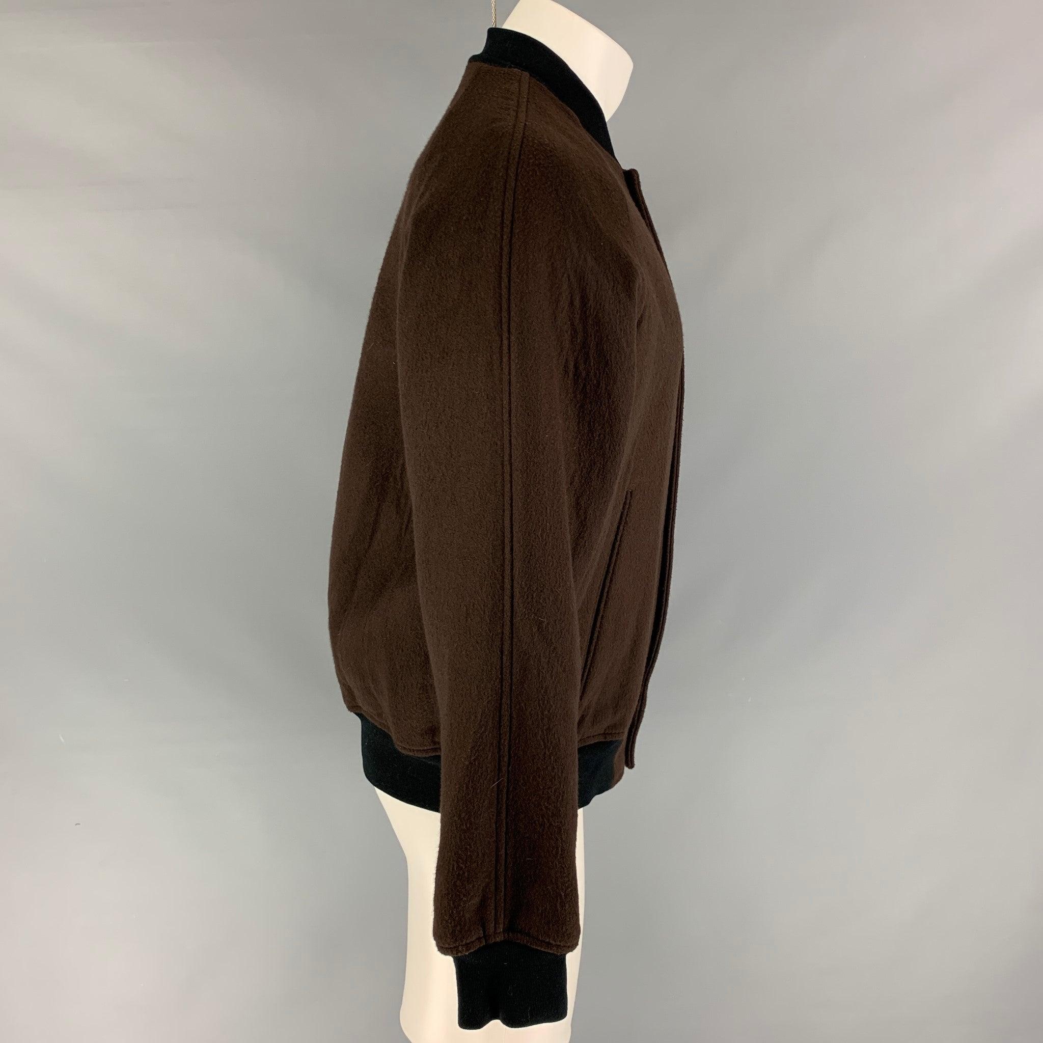 MARC JACOBS jacket comes in a brown wool blend featuring a bomber style, loose fit, ribbed hem, and a snap button closure. Made in Italy.
Very Good
Pre-Owned Condition. 

Marked:   48 

Measurements: 
 
Shoulder: 17 inches  Chest: 44 inches  Sleeve: