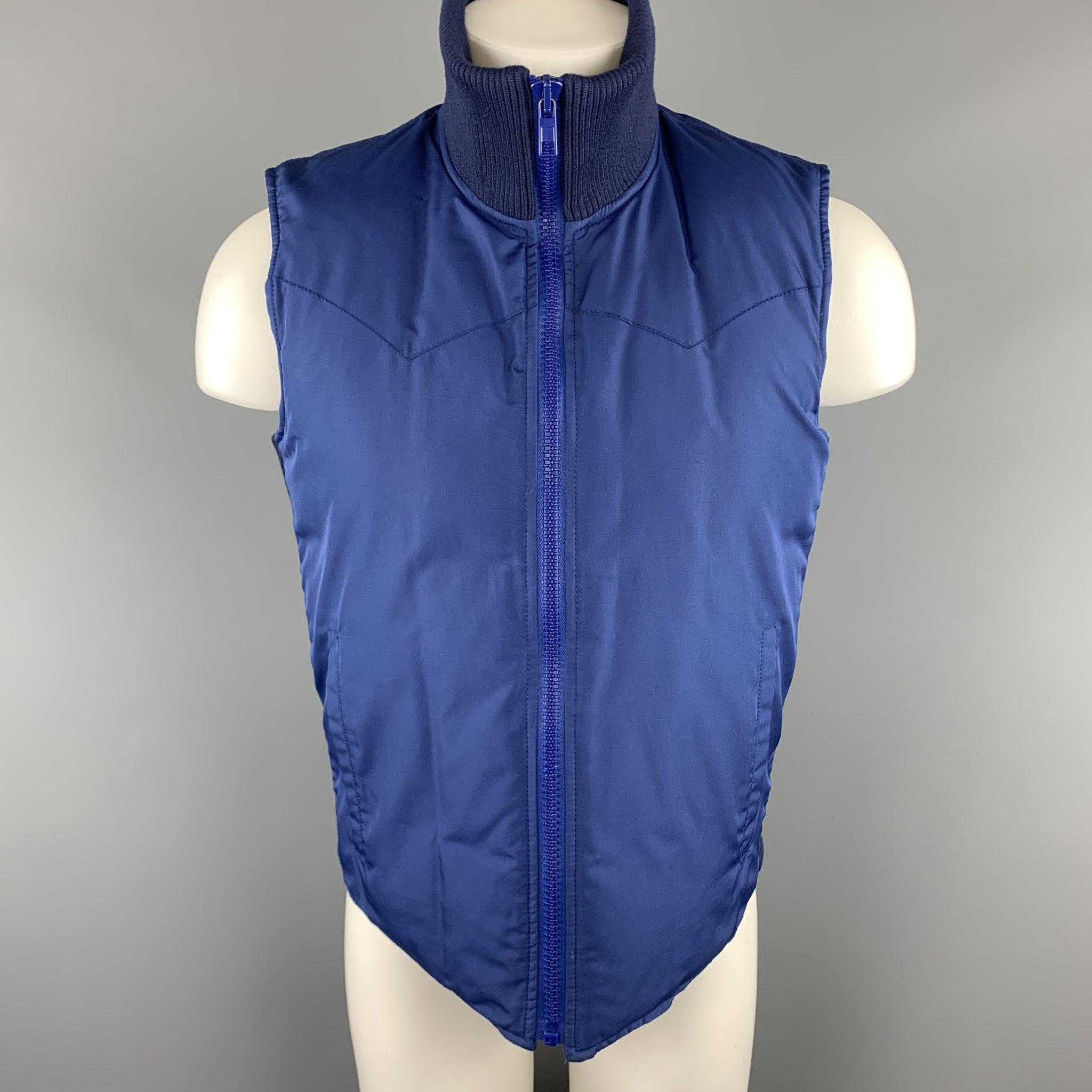 MARC JACOBS puff vest comes in royal blue material with western stitch shoulders, blue zip front, and high ribbed knit collar and side panels. Made in Italy.Excellent
Pre-Owned Condition. 

Marked:   IT 48 

Measurements: 
 
Shoulder:
16 inches