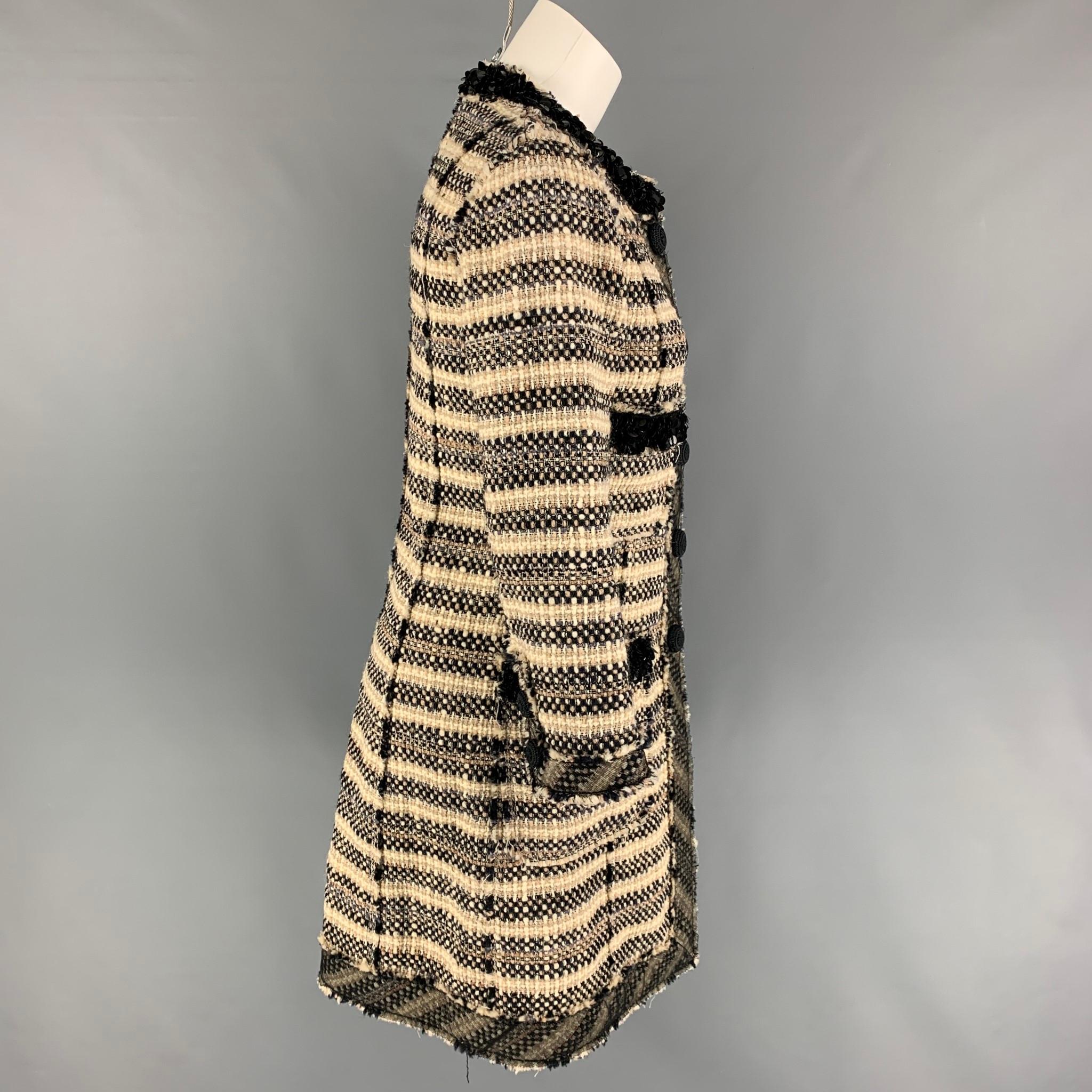 MARC JACOBS coat comes in a beige & black tweed wool featuring a collarless style, sequin trim, patch pockets, and a snap button closure. 

Very Good Pre-Owned Condition.
Marked: 4

Measurements:

Shoulder: 15 in.
Bust: 34 in.
Sleeve: 21 in.
Length: