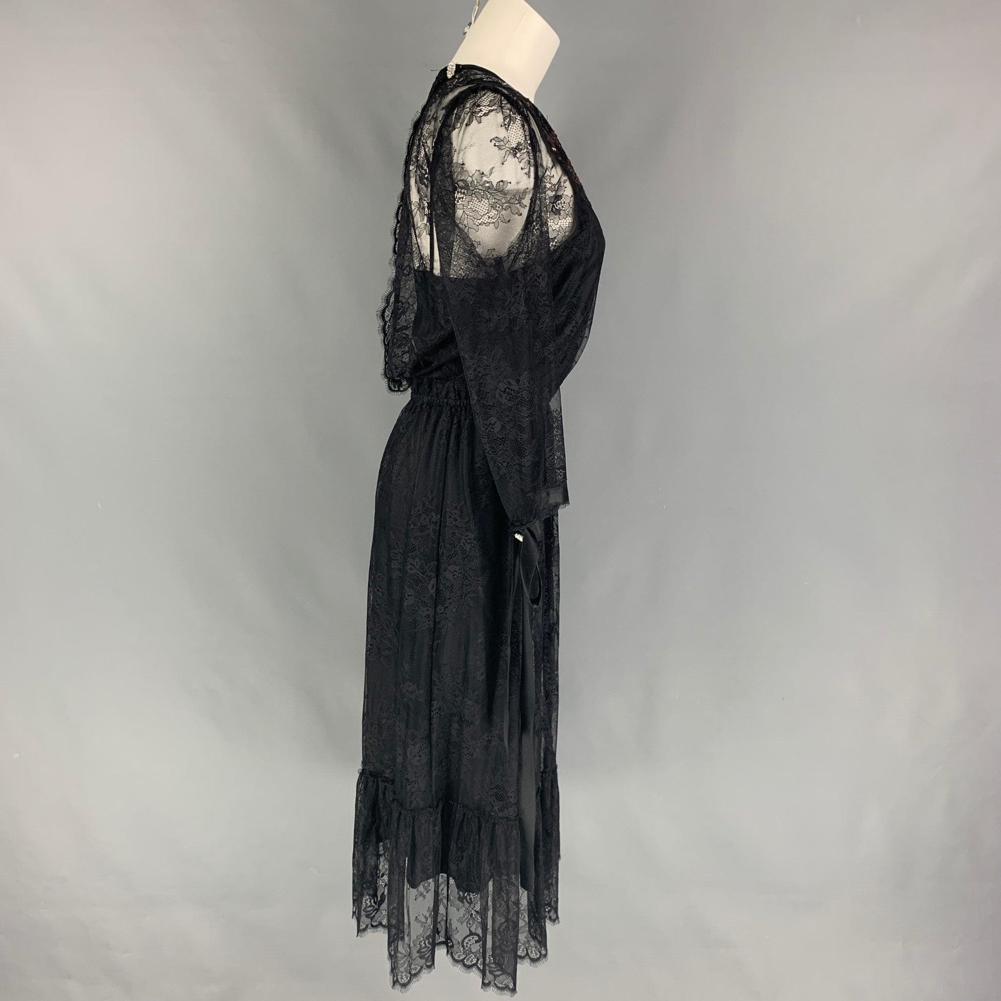 MARC JACOBS dress comes in a black lace nylon with a slip liner, ribbon sleeve details, floral sequin design, back rhinestone detail, and a elastic waistband.
Very Good
Pre-Owned Condition. 

Marked:   4 

Measurements: 
 
Shoulder: 14 inches  Bust: