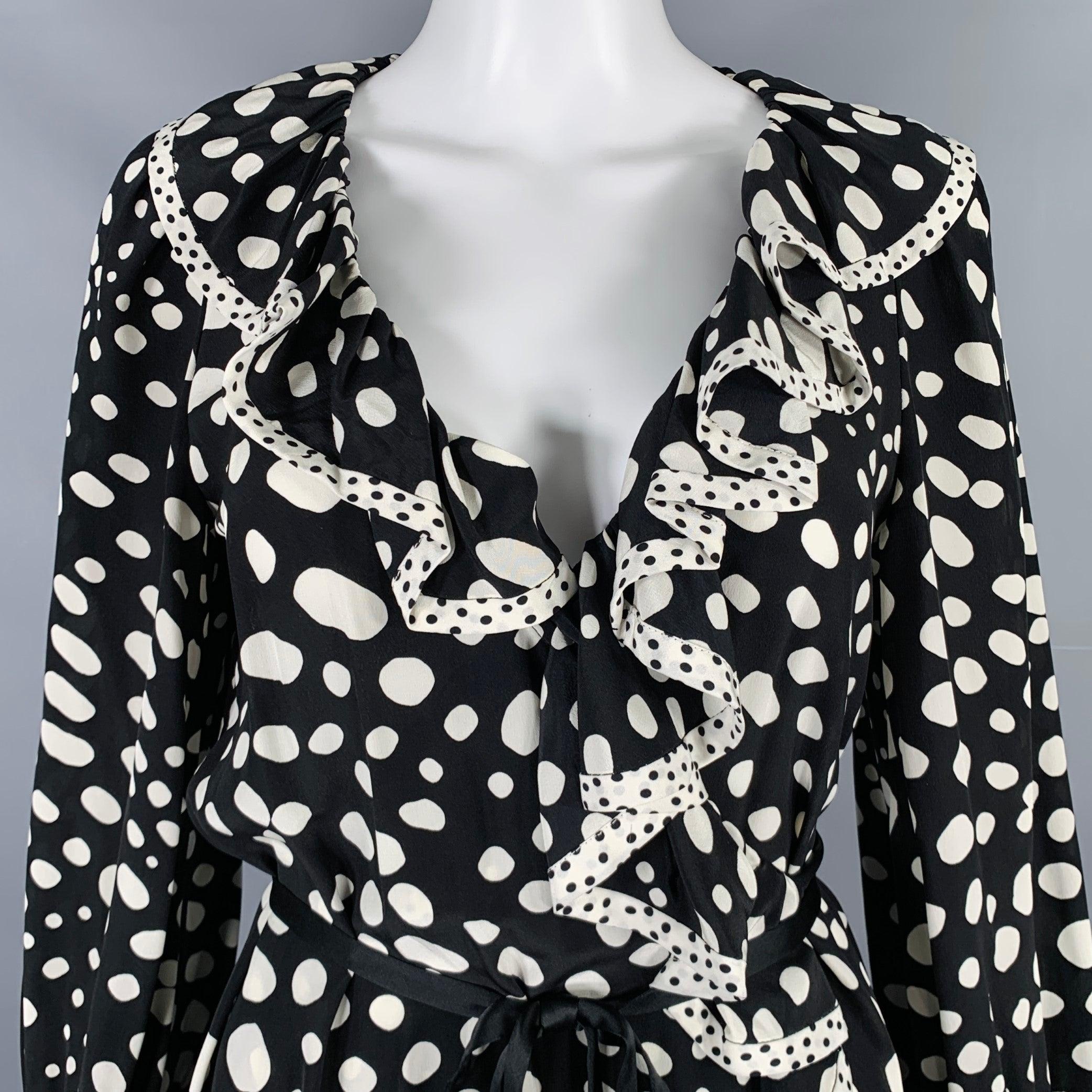 MARC JACOBS dress
in a
black and white fabric featuring a wrap style, ruffle details with contrast trim, and tie closure.Excellent Pre-Owned Condition. 

Marked:   4 

Measurements: 
 
Shoulder: 12 inches Sleeve: 23.5 inches Bust: 38 inches Waist: