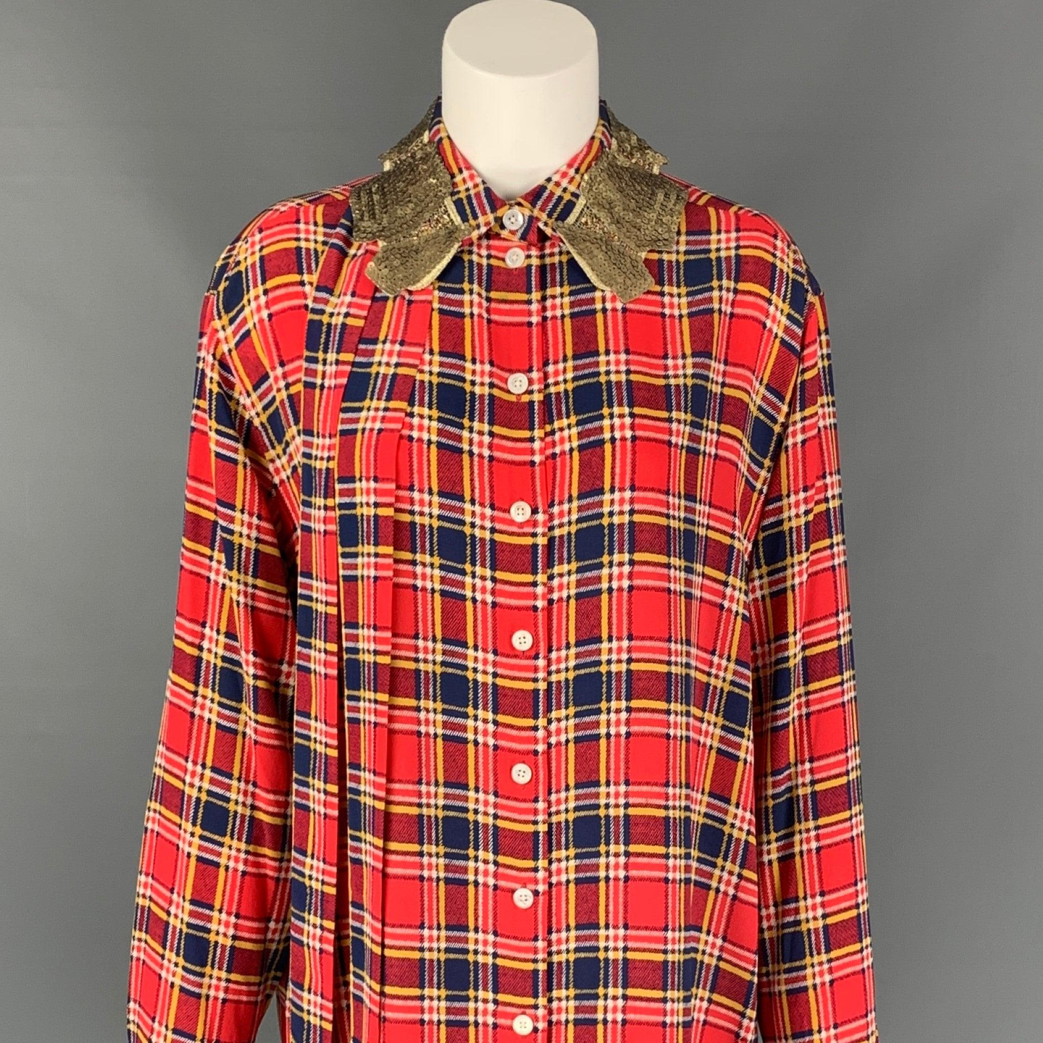 MARC JACOBS long shirt comes in a red & blue plaid silk featuring a loose fit, front bow design, sequined collar, and a buttoned closure.
Excellent
Pre-Owned Condition. 

Marked:   4 

Measurements: 
 
Shoulder: 18.5 inches  Bust: 44 inches 