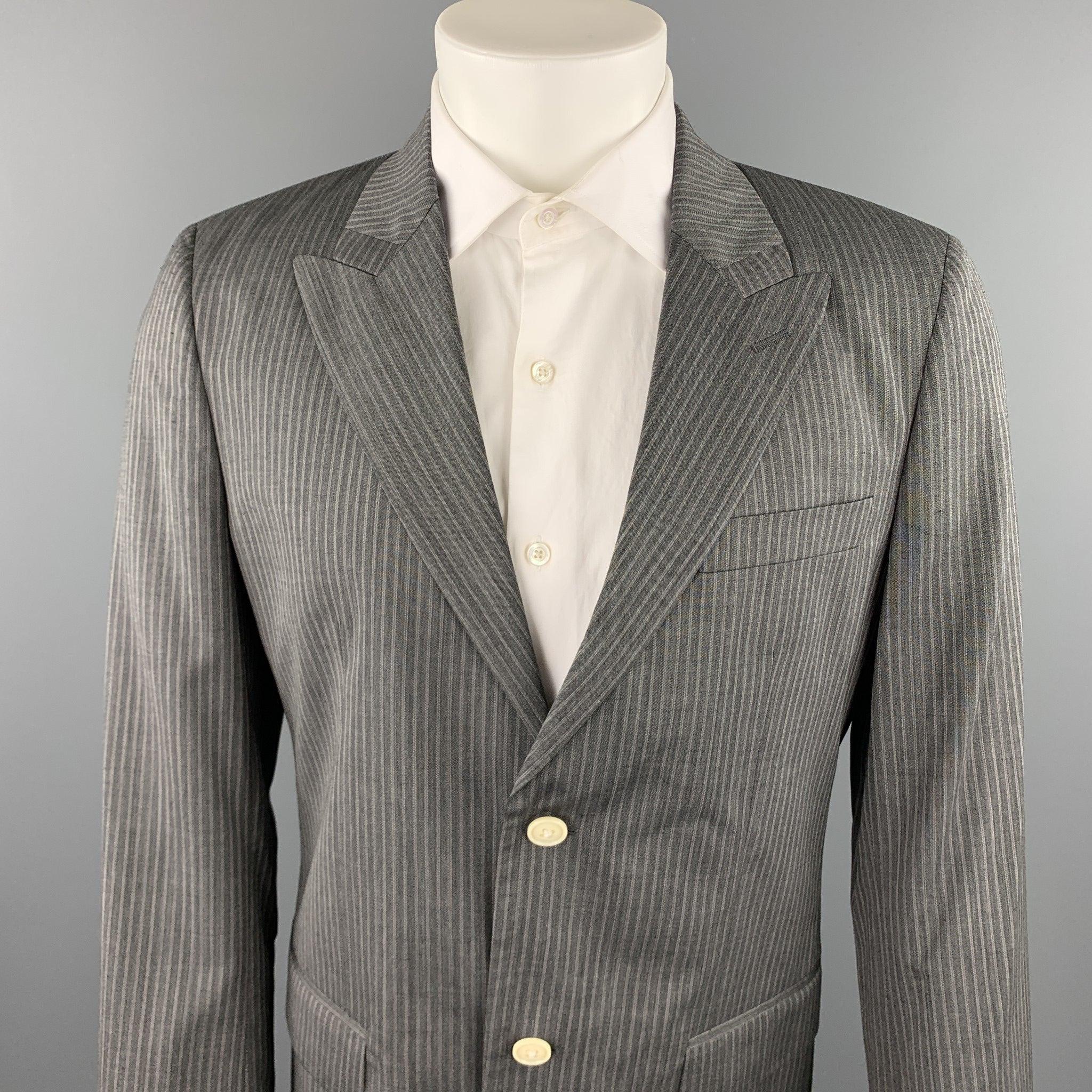 MARC JACOBS sport coat comes in a gray stripe wool with a full white liner featuring a peak lapel, flap pockets, and a two button closure. Made in Italy.New With Tags. 

Marked:   IT 50 

Measurements: 
 
Shoulder: 17.5 inches 
Chest: 40 inches