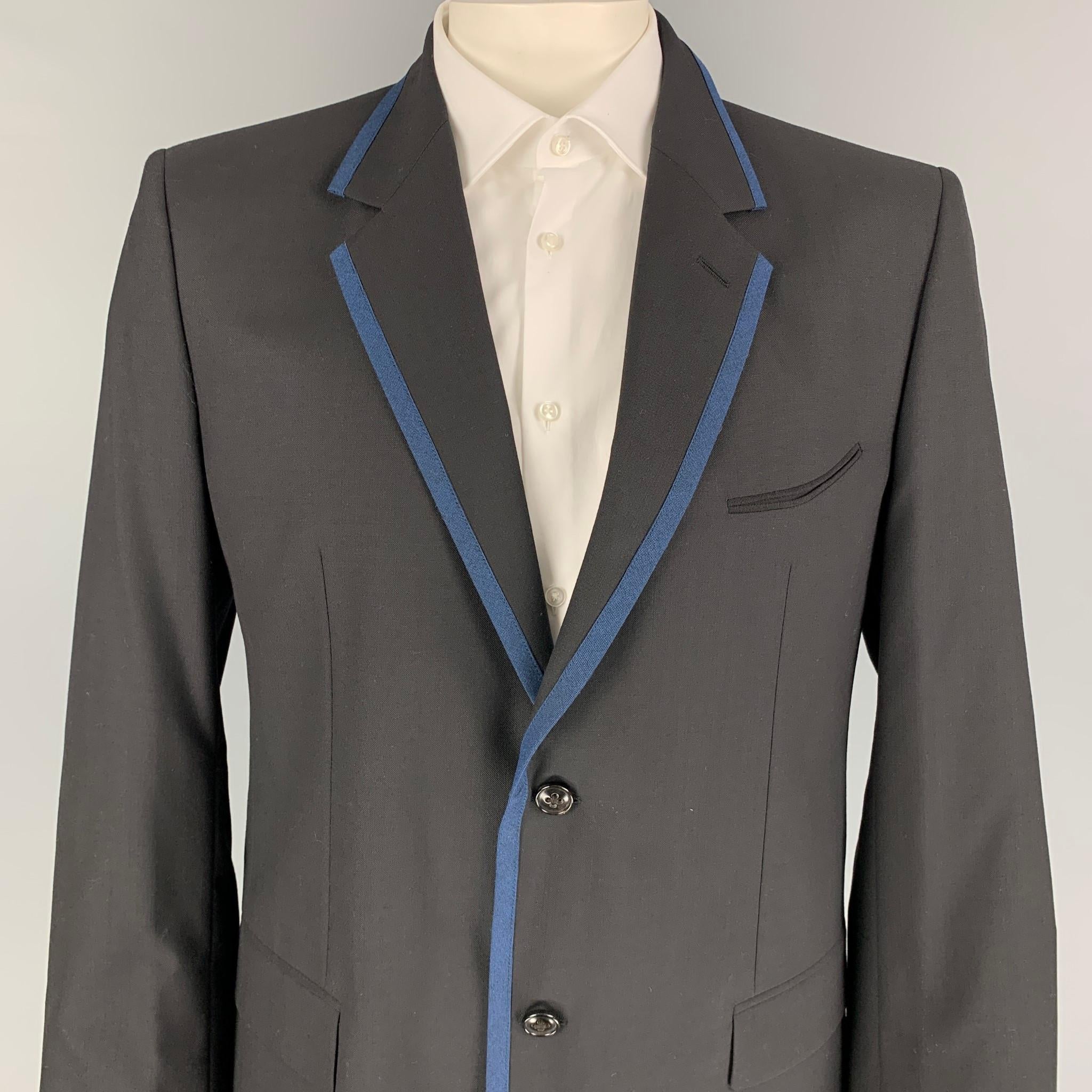 MARC JACOBS sport coat comes in a black wool with a full liner featuring a notch lapel, blue trim, flap pockets, double back vent, and a double button closure. Made in Italy. 

New With Tags. 
Marked: 54

Measurements:

Shoulder: 18.5 in.
Chest: 44