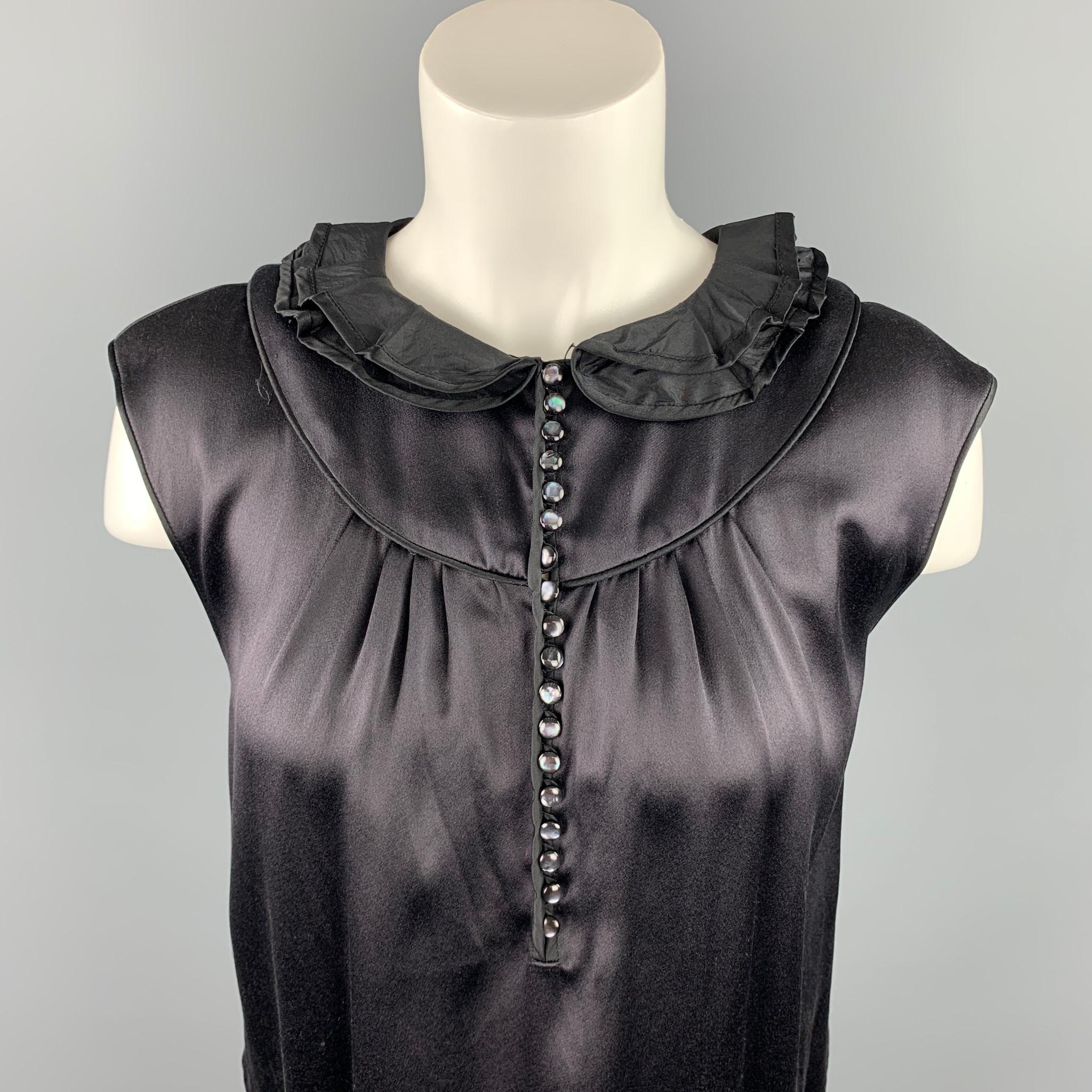 MARC JACOBS sleeveless dress top comes in a black satin silk featuring a ruffled collar and a buttoned closure. Made in USA.

Brand New.
Marked: 6
Original Retail Price: $925.00

Measurements:

Shoulder: 17 in.
Bust: 36 in.
Length: 22.5 in. 