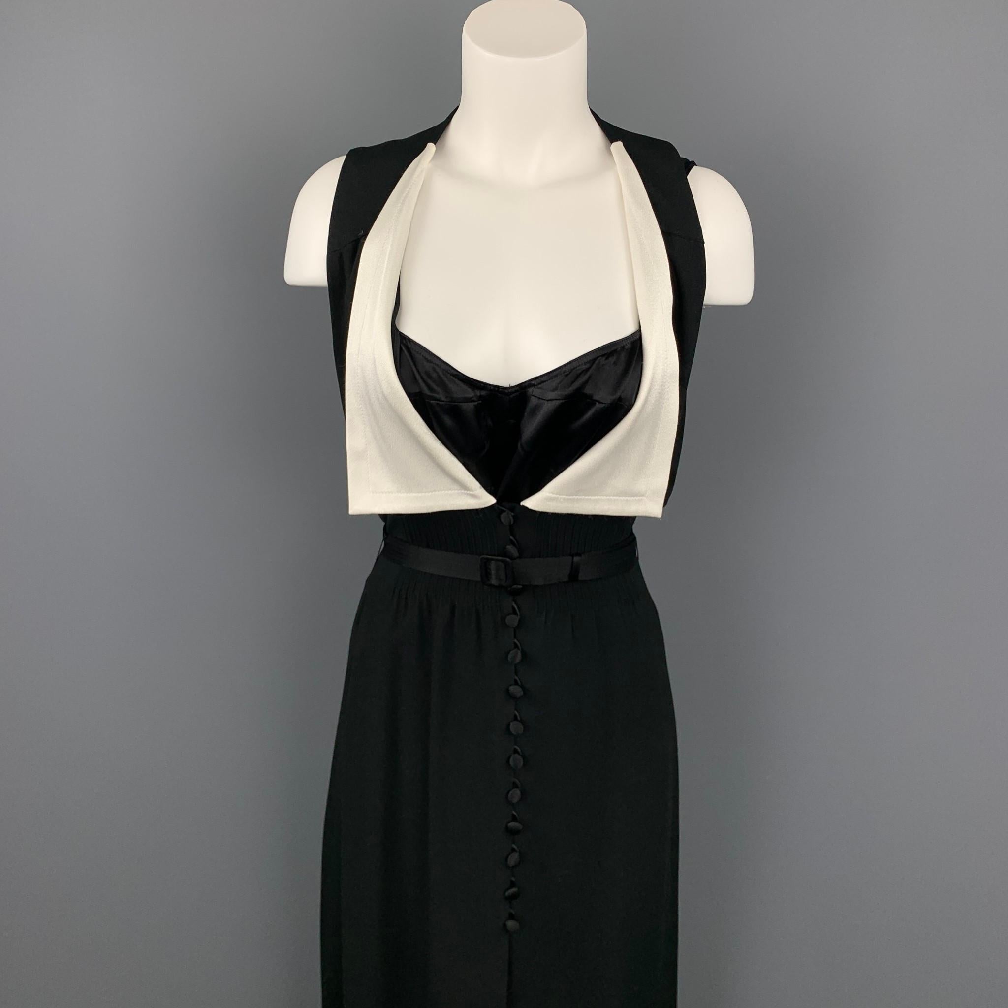 MARC JACOBS dress comes in a black crepe acetate / viscose with a slip liner featuring a belted styled, white collar, open back, and a front buttoned closure.

Good Pre-Owned Condition.
Marked: 6

Measurements:

Shoulder: 12.5 in. 
Bust: 32 in.