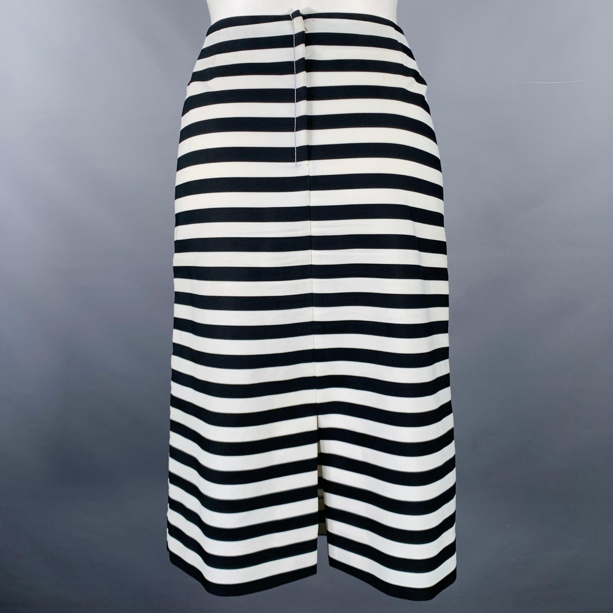 MARC JACOBS skirt in a black and white polyester fabric featuring a stripe pattern, pencil style, silk lining, and back zipper closure. Made in USA.Very Good Pre-Owned Condition. Minor signs of wear. 

Marked:   6 

Measurements: 
  Waist: 32 inches