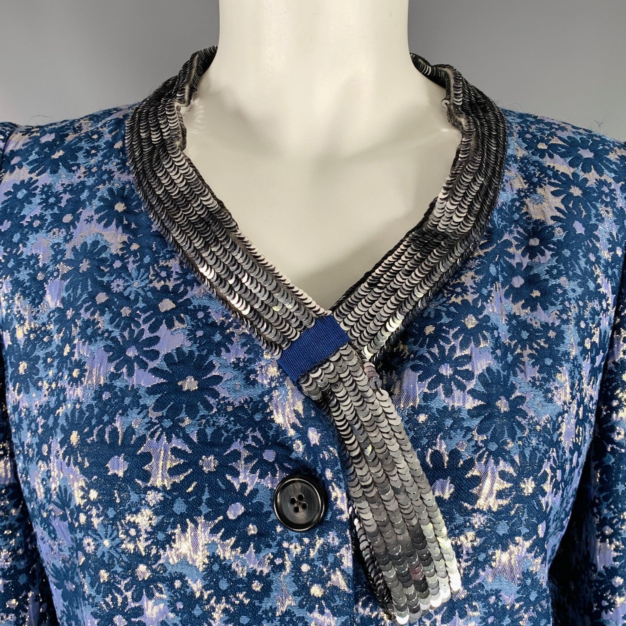 MARC JACOBS jacket
in a blue and silver tone acetate blend featuring a floral pattern jacquard, sequined collar, and faux button closure with snaps. Made in USA.Very Good Pre-Owned Condition. Moderate signs of wear. 

Marked:   6 

Measurements: 
