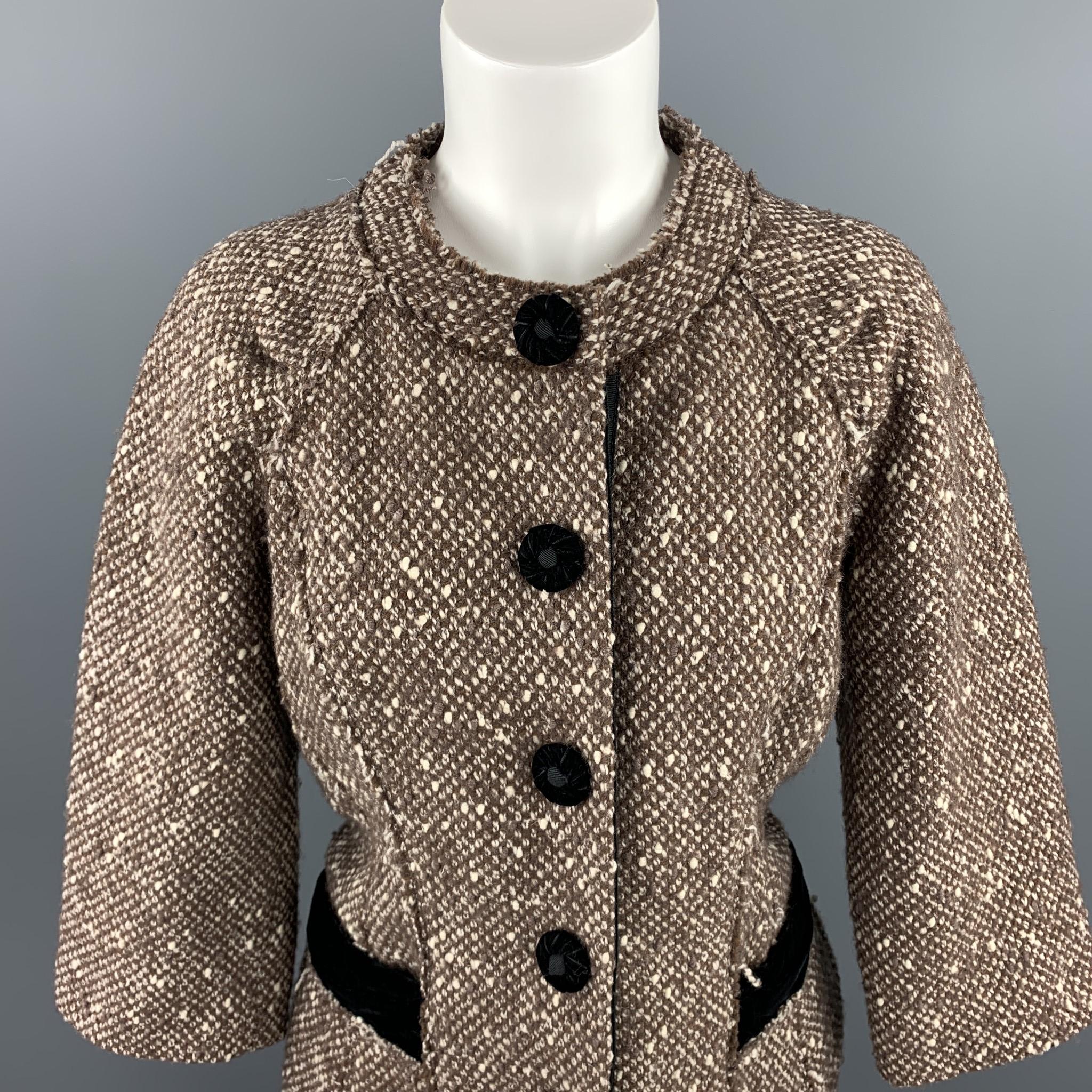 MARC JACOBS jacket comes in a brown boucle wool blend with a black velvet trim featuring a round neck, slit pockets, and a snap button closure with velvet buttons. Made in USA.

Very Good Pre-Owned Condition.
Marked: 6

Measurements:

Shoulder: 17.5