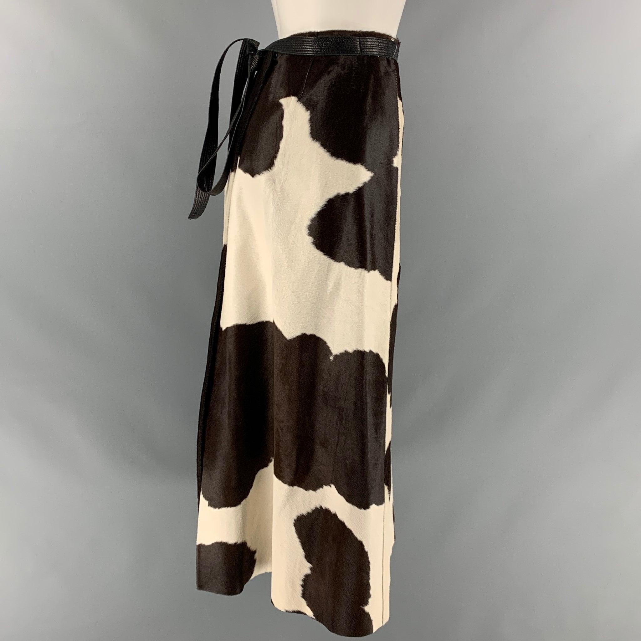 MARC JACOBS skirt comes in a brown and cream calf hair leather featuring a wrap style, leather belt, and frontal pockets. Made in US.Very Good Pre- Owned Conditions. 

Marked:   6 

Measurements: 
  Waist: 30 inches Hip: 40 inches Length: 32 inches