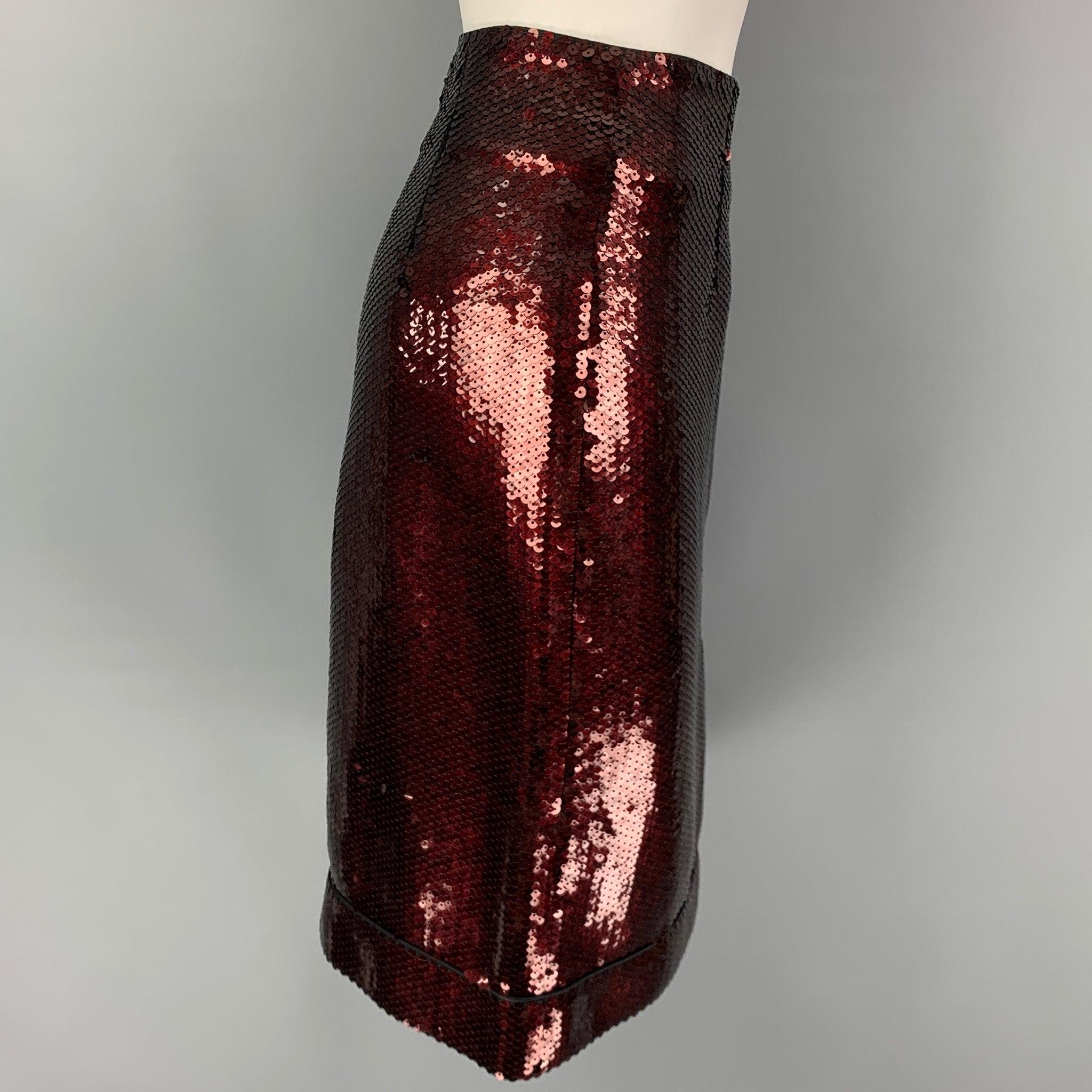 MARC JACOBS skirt comes in a burgundy & black sequined polyester blend featuring an a-line style and a back zip up closure.
Excellent
Pre-Owned Condition. 

Marked:   6 

Measurements: 
  Waist:
29 inches Hip: 38 inches Length: 24 inches 
  
  
