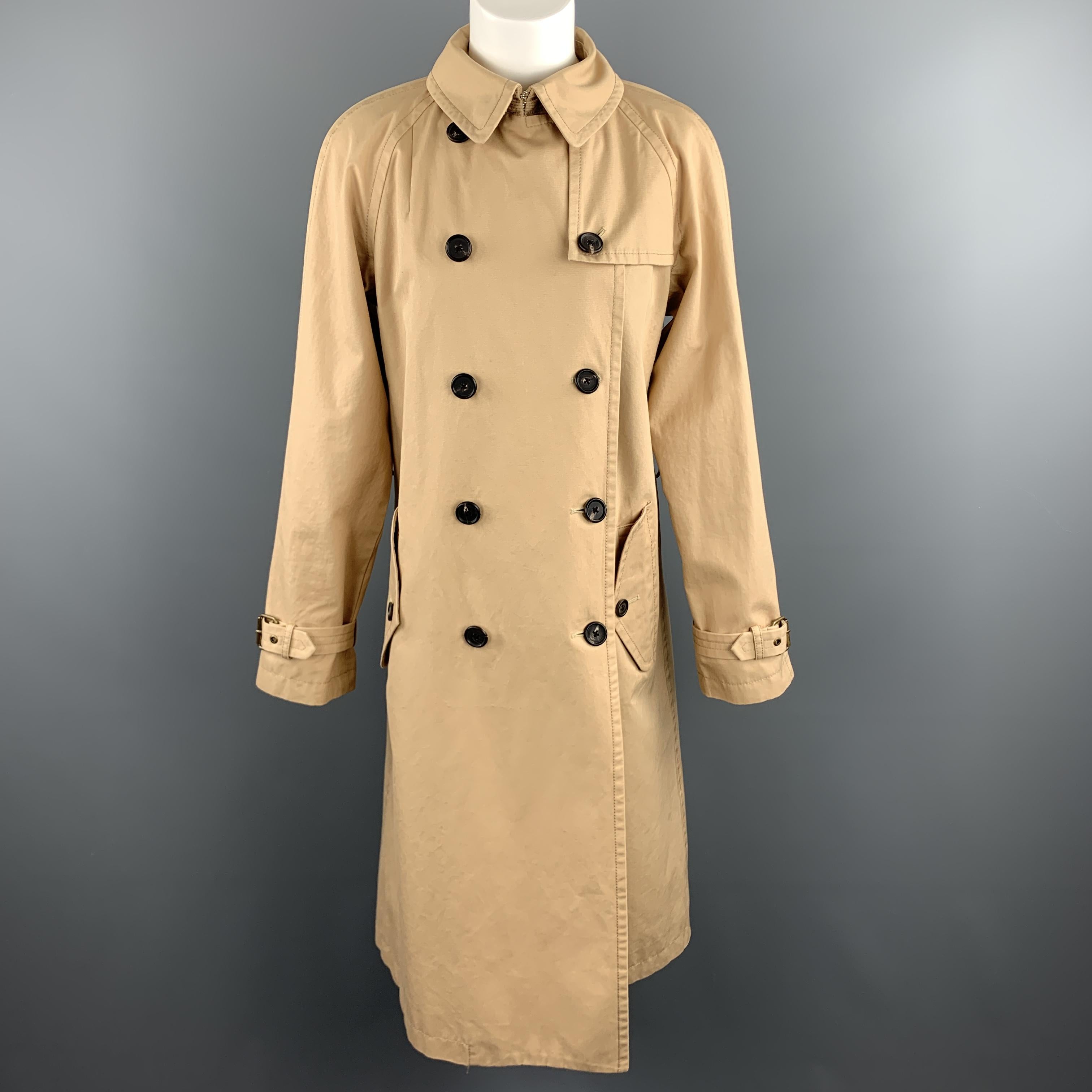 MARC JACOBS trench coat comes in in a warm khaki cotton twill with a double breasted button front, flap button pockets, and belted waist. Satin lined. Made in USA.

Excellent Pre-Owned Condition.
Marked: US 6

Measurements:

Shoulder: 17 in.
Bust: