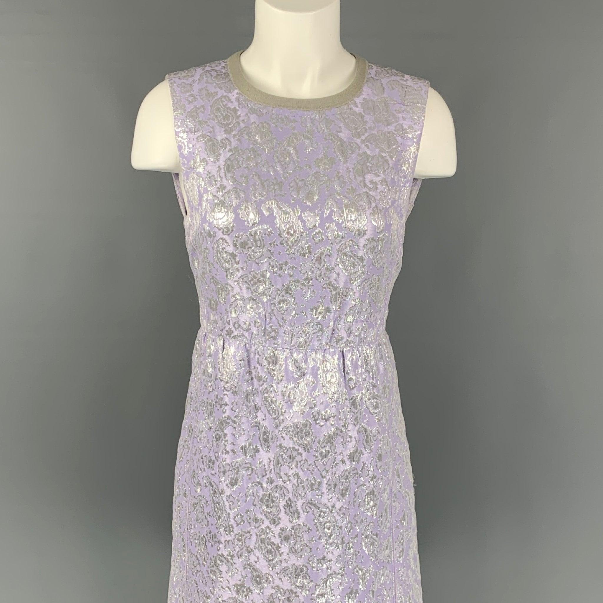 MARC JACOBS dress comes in a lavender & silver jacquard acetate blend wth a slip liner featuring a sheath style, sleeveless, and a back zipper closure. Made in USA.
Very Good Pre-Owned Condition. 

Marked:   6 

Measurements: 
 
Shoulder: 14 inches 