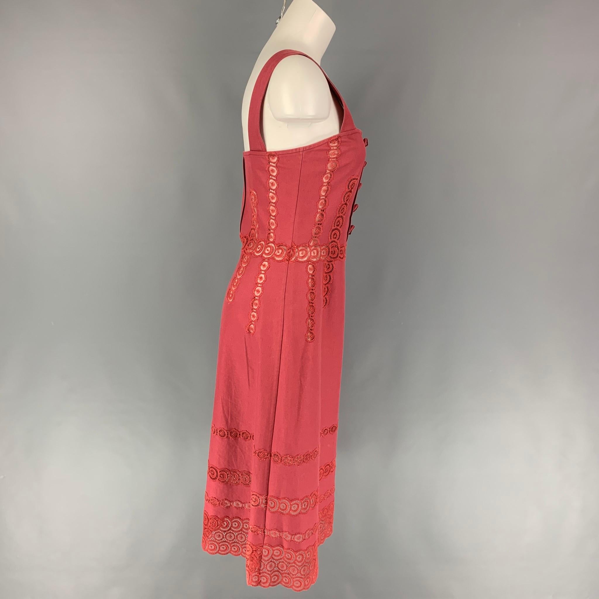 MARC JACOBS dress comes in a raspberry cotton featuring eyelet details, a-line style, front button details, and a side zipper closure. 

Very Good Pre-Owned Condition.
Marked: 6

Measurements:

Bust: 31 in.
Waist: 29 in.
Hip: 36 in.
Length: 35 in. 