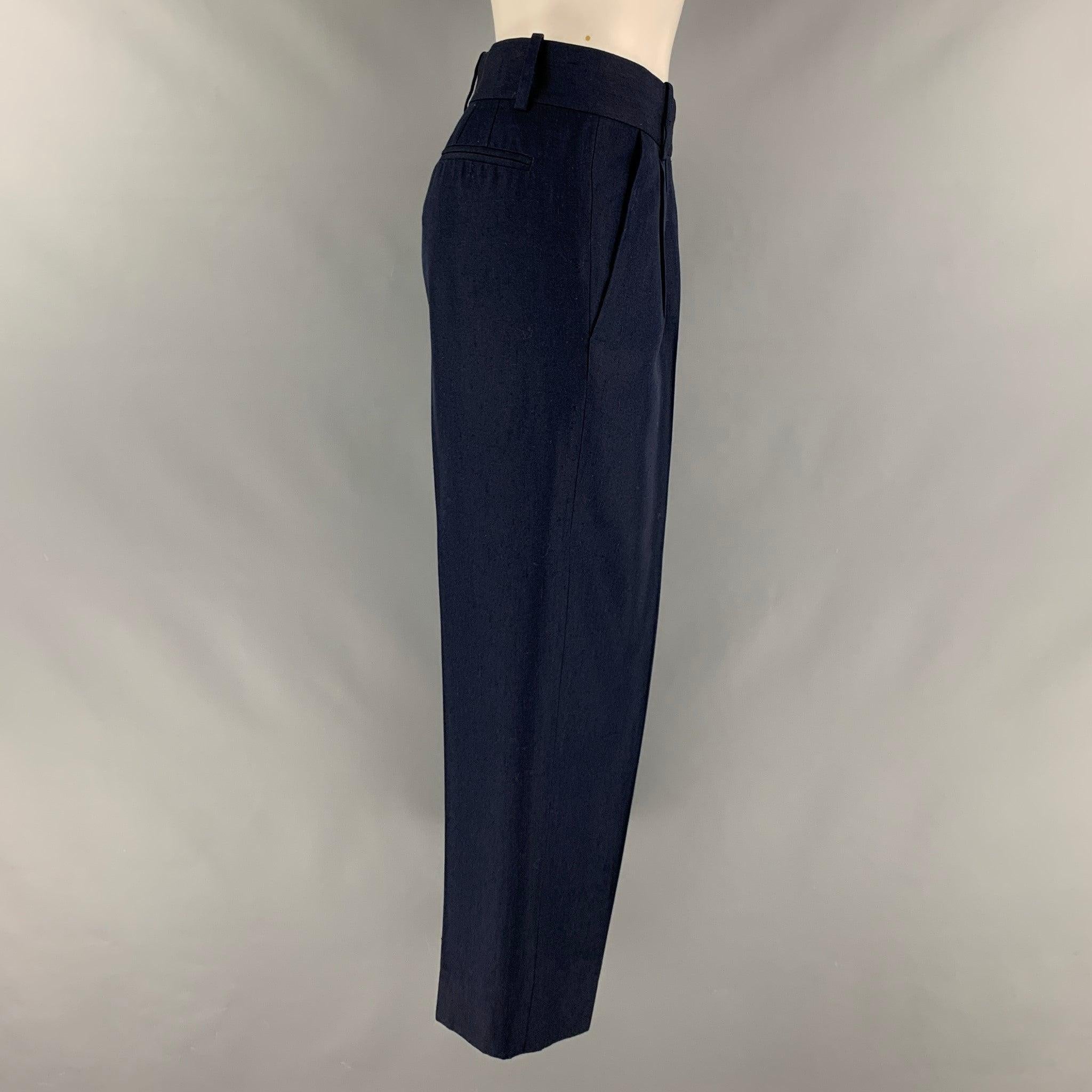 MARC JACOBS dress pants comes in a navy silk woven material featuring a pleated front,
 front tab, and a zip fly closure. Made in USA.Good Pre-Owned Condition. AS IS 

Marked:  8 

Measurements: 
 Waist: 34 inches Rise: 10 inches Inseam: 24 inches 
