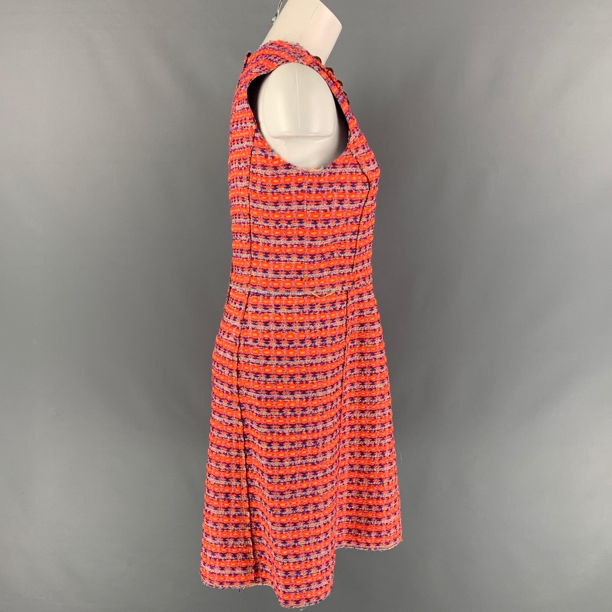 MARC JACOBS dress comes in a orange & purple tweed acrylic blend featuring a shift style, beaded neckline, sleeveless, and a back zip up closure.
Very Good
Pre-Owned Condition. 

Marked:   8 

Measurements: 
 
Shoulder: 14 inches  Bust: 38 inches 