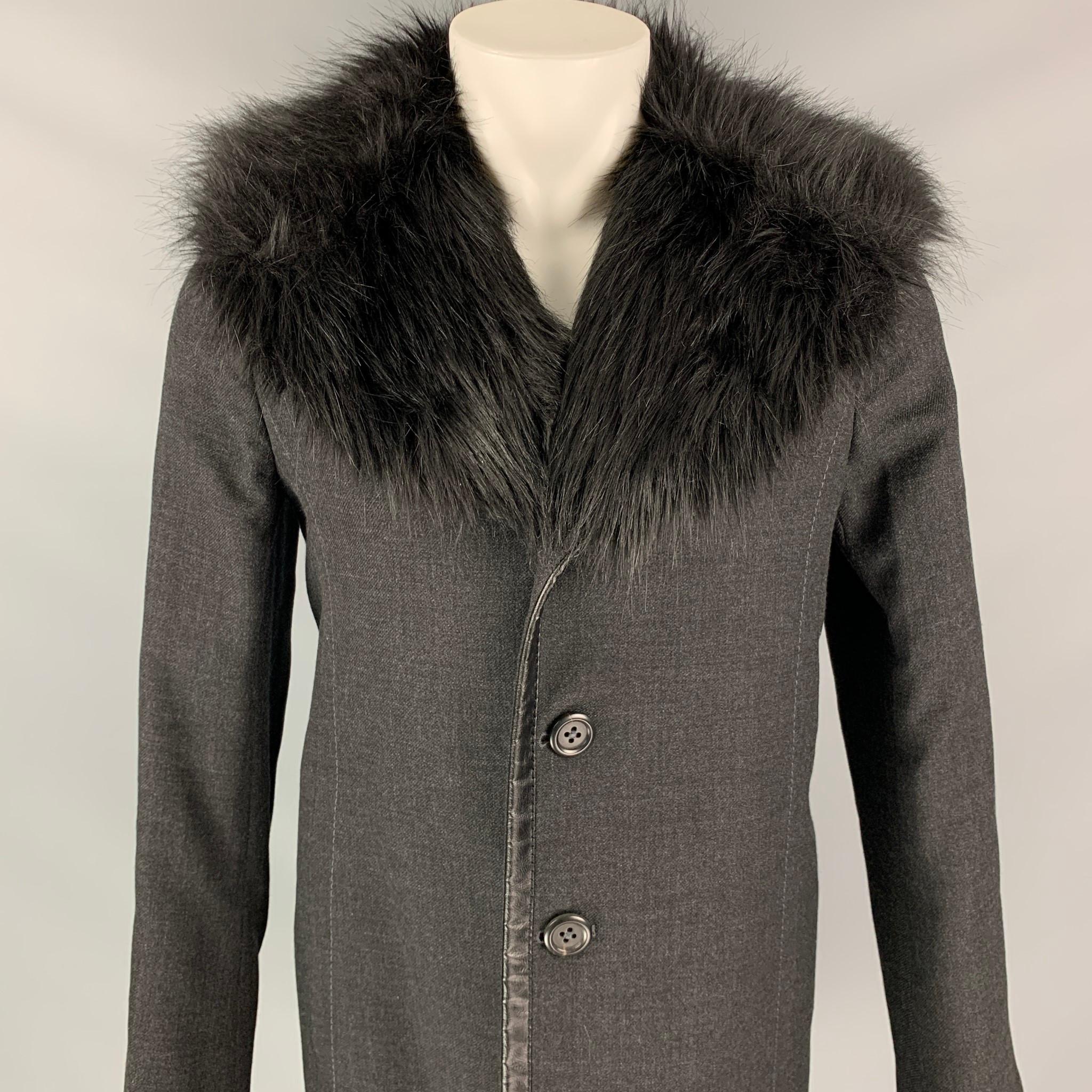 MARC JACOBS car coat comes in a charcoal wool with a full quilted liner featuring a faux fur lapel, leather trim, top stitching, slit pockets, and a buttoned closure. 

Very Good Pre-Owned Condition.
Marked: L

Measurements:

Shoulder: 17 in.
Chest:
