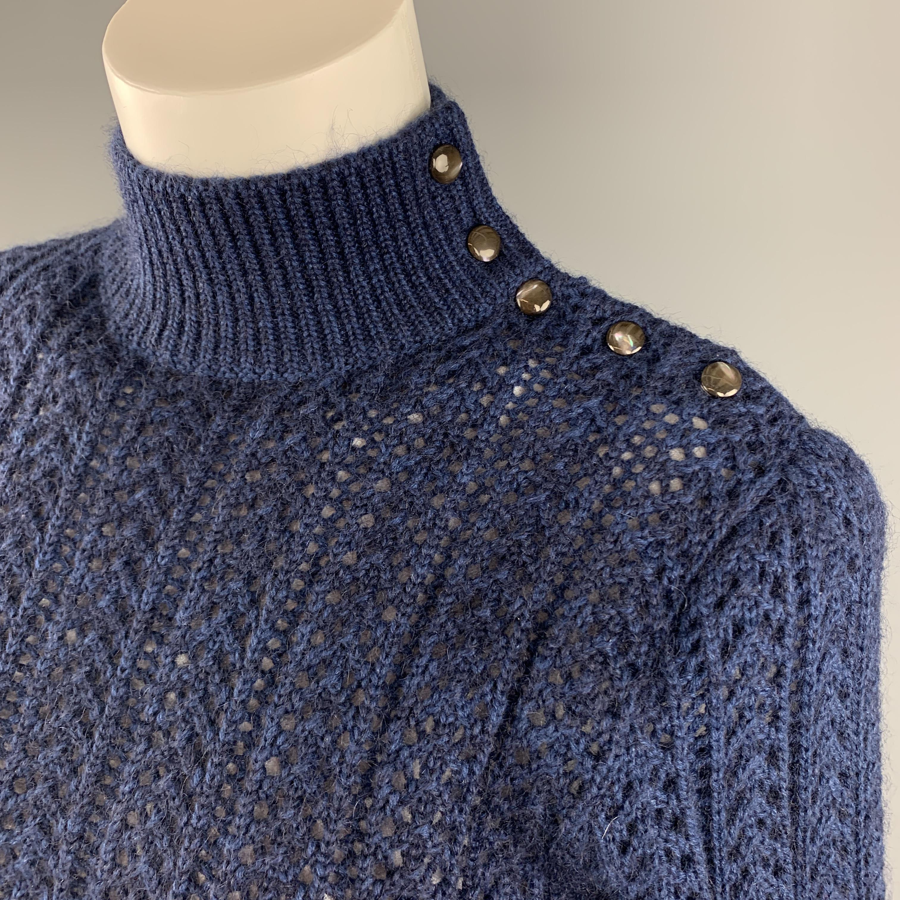 MARC JACOBS sweater comes in blue cashmere blend textured knit with a high neck collar that buttons on the side and cropped hem. Made in Italy.

Excellent Pre-Owned Condition.
Marked: L

Measurements:

Shoulder: 15 in.
Bust: 36 in.
Sleeve: 25