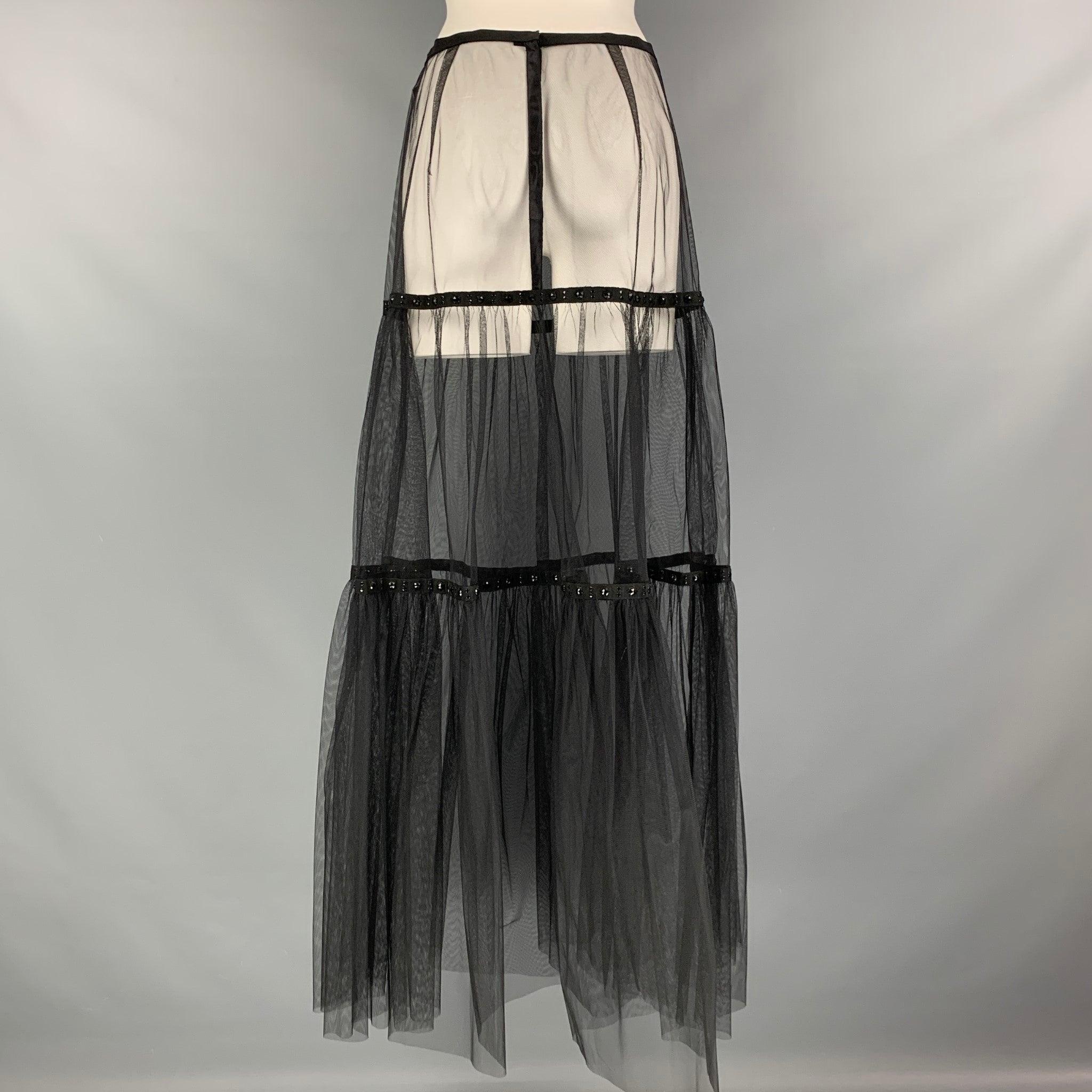 MARC JACOBS max skirt comes in a black tulle material featuring see through style, snap button closure, and black rhinestones details. Very Good Pre-Owned Condition. 

Marked:   no size marked. 

Measurements: 
  Waist: 29 inHip: 41 inches Length: