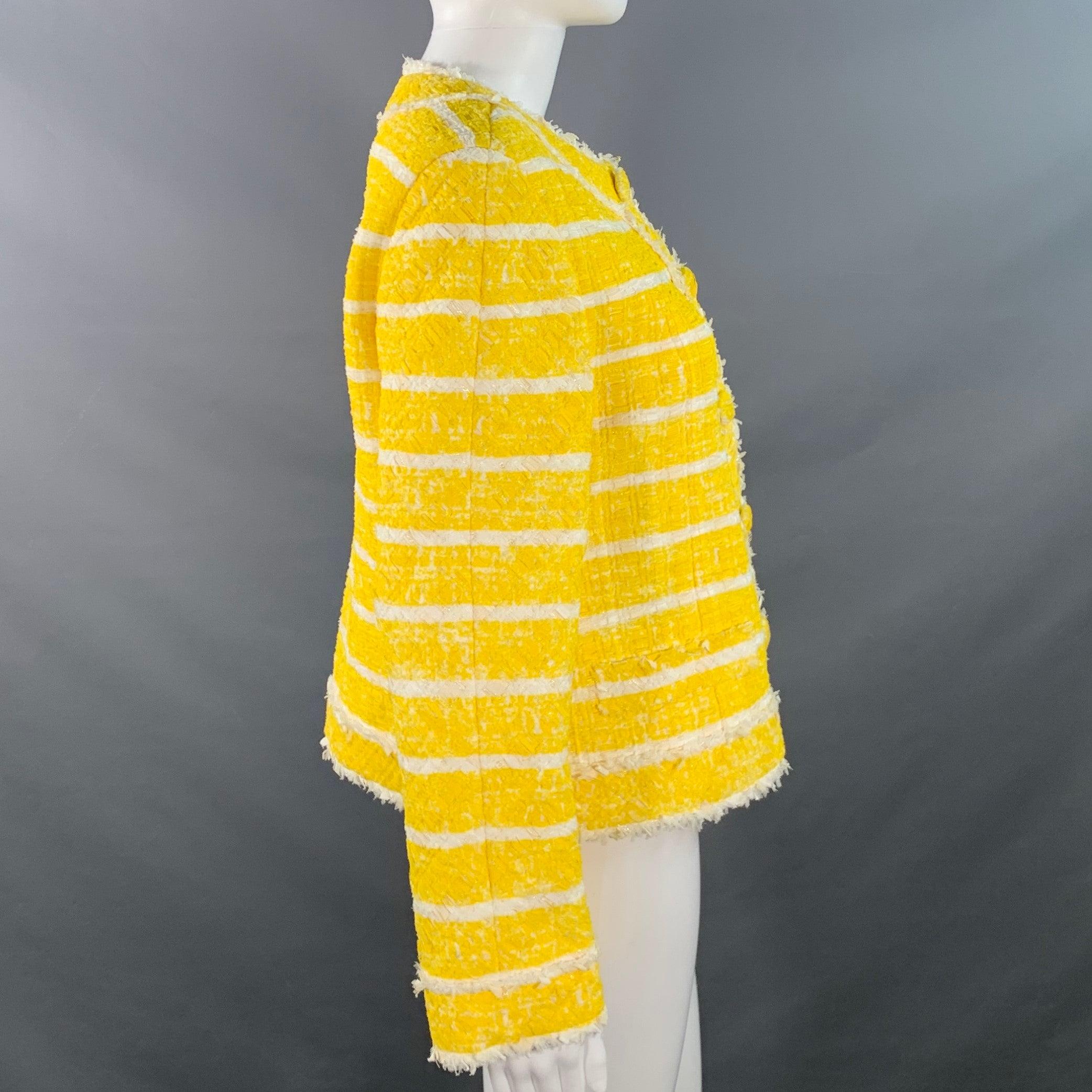 MARC JACOBS jacket
in a yellow and white nylon blend boucle featuring a stripe pattern, collarless design, and snap closure with button illusion.Excellent Pre-Owned Condition. 

Marked:   size not marked 

Measurements: 
 
Shoulder: 14.75 inches