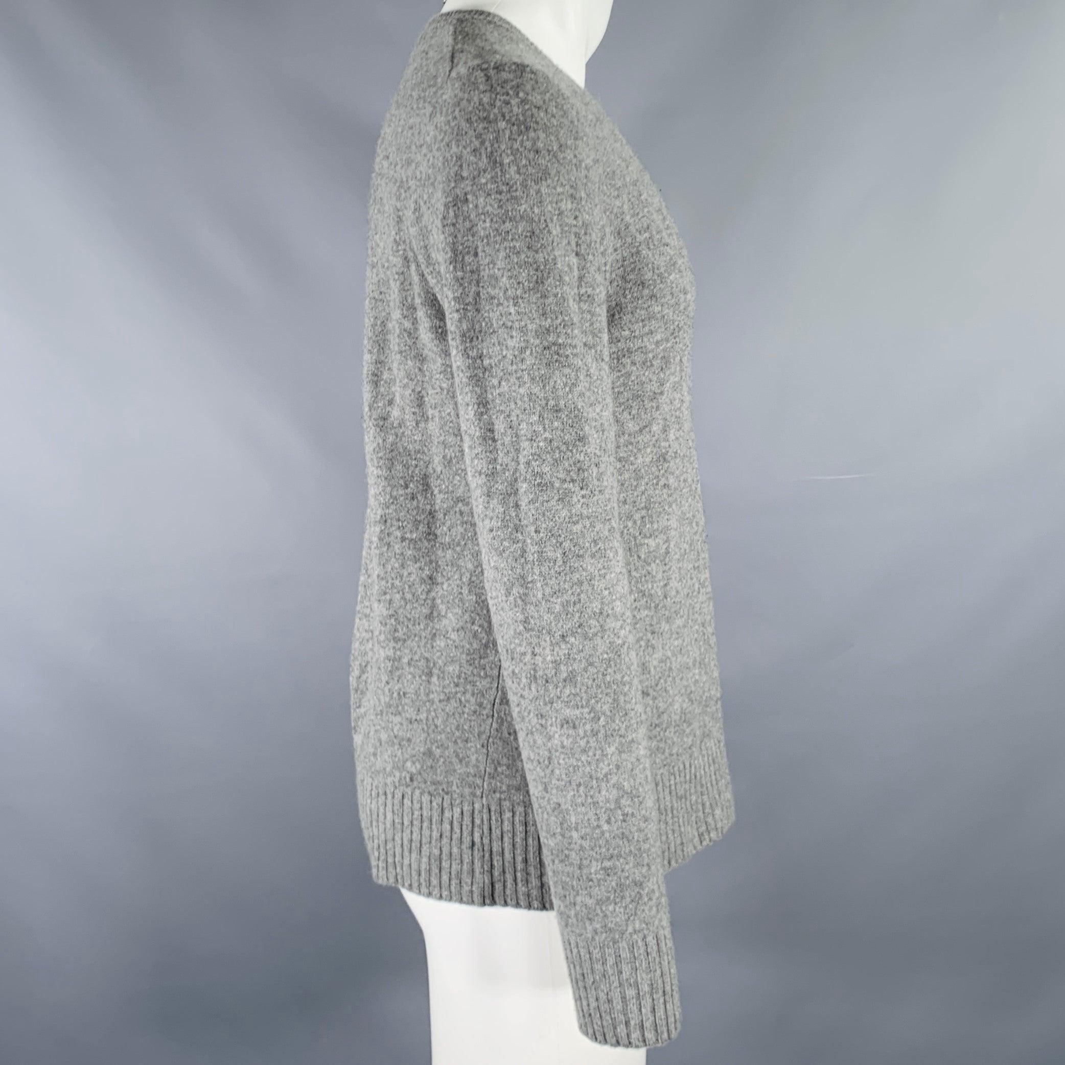 MARC JACOBS sweater
in a heather grey wool cashmere blend knit featuring long sleeves and a V-neck. Made in Italy.Very Good Pre-Owned Condition. Minor pilling. 

Marked:   S 

Measurements: 
 
Shoulder: 17.5 inches Chest: 39 inches Sleeve: 25.5
