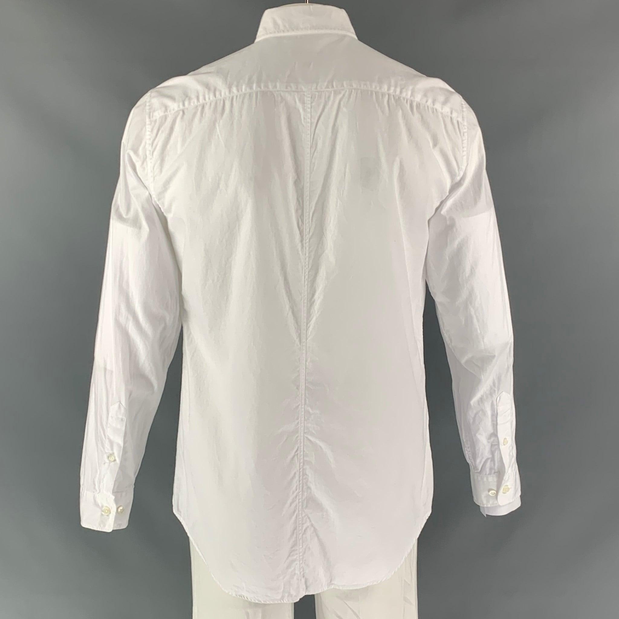 MARC JACOBS long sleeve dress shirt comes in white cotton fabric, button up closure, spread collar, removable collar stays and two button round sleeve cuff. Made in Italy.Excellent Pre-Owned Condition. 

Marked:   54 

Measurements: 
 
Shoulder: