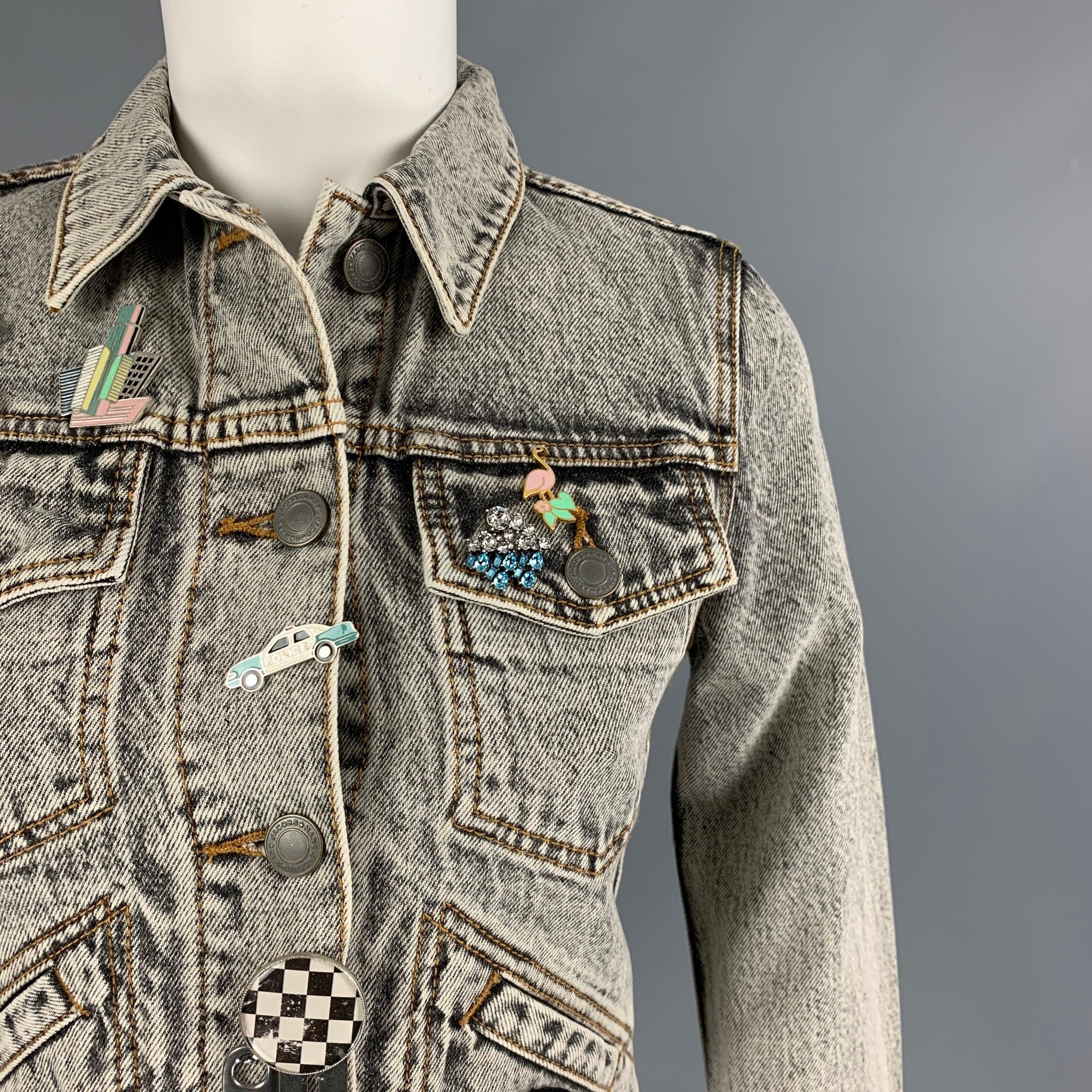 MARC JACOBS jacket comes in a black acid-wash denim featuring a cropped style, pin details, patches throughout, contrast stitching, front pockets, a back embroidered 'paradise' design, and a buttoned closure. 

New With Tags.
Marked: