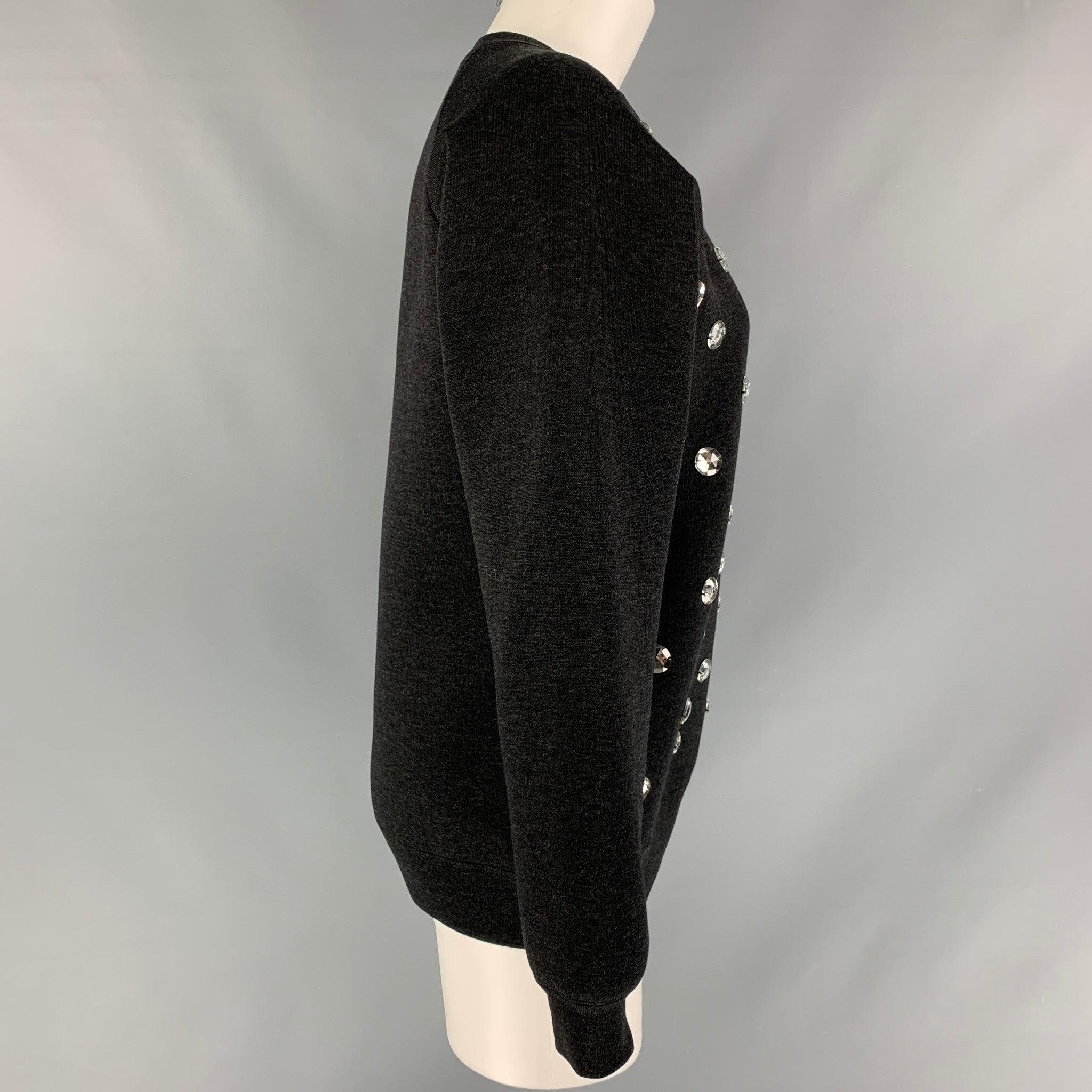 MARC JACOBS long sleeves pullover comes in a black wool blend heather jersey fabric featuring appliques at front. Made in Italy.Excellent Pre-Owned Condition. 

Marked:   XS 

Measurements: 
 
Shoulder: 16.5 inches Bust: 40 inches Sleeve: 23.5